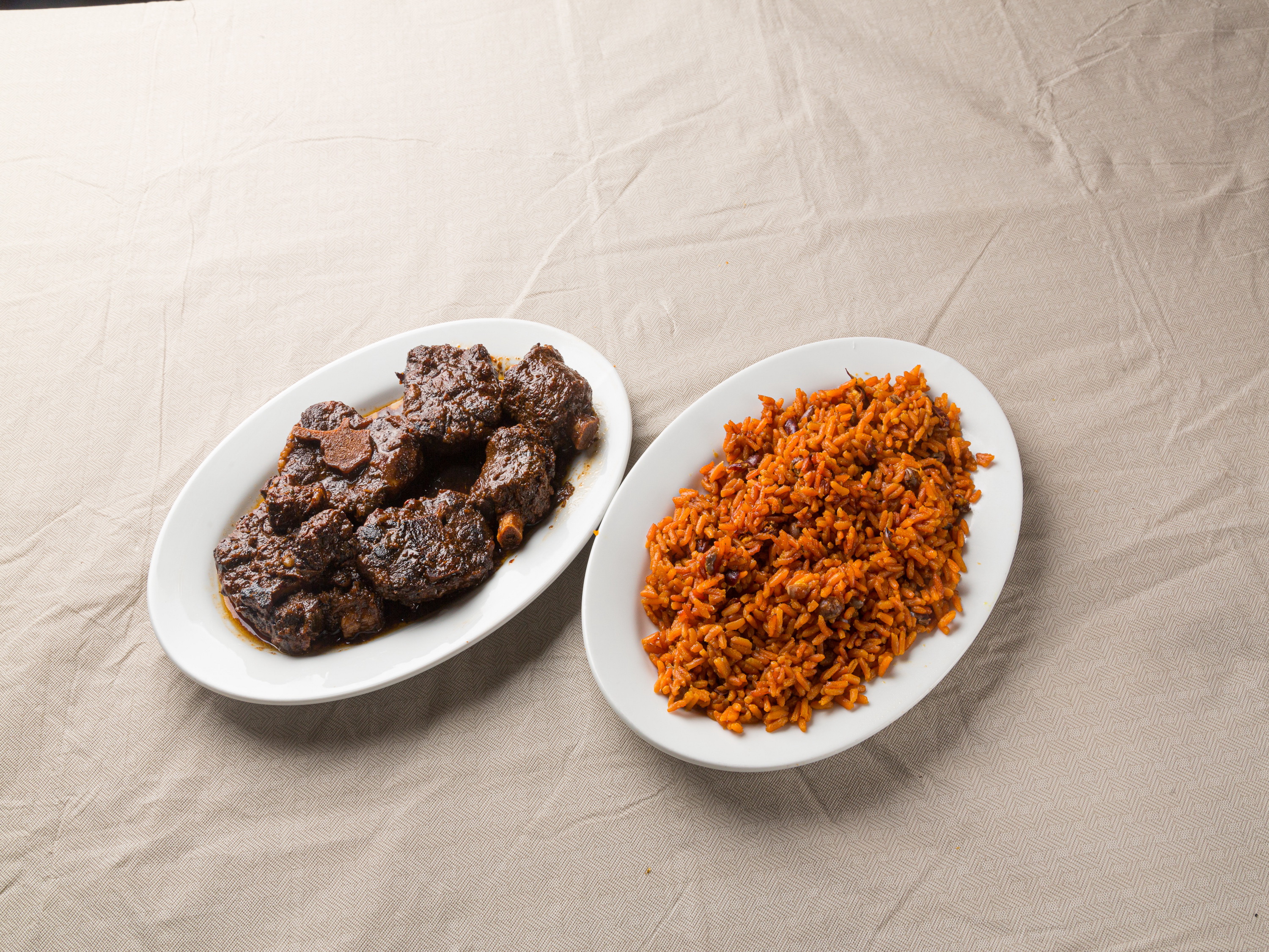 Order Oxtail with Beans and Rice food online from Coconut Palm Bar & Grill store, Bronx on bringmethat.com