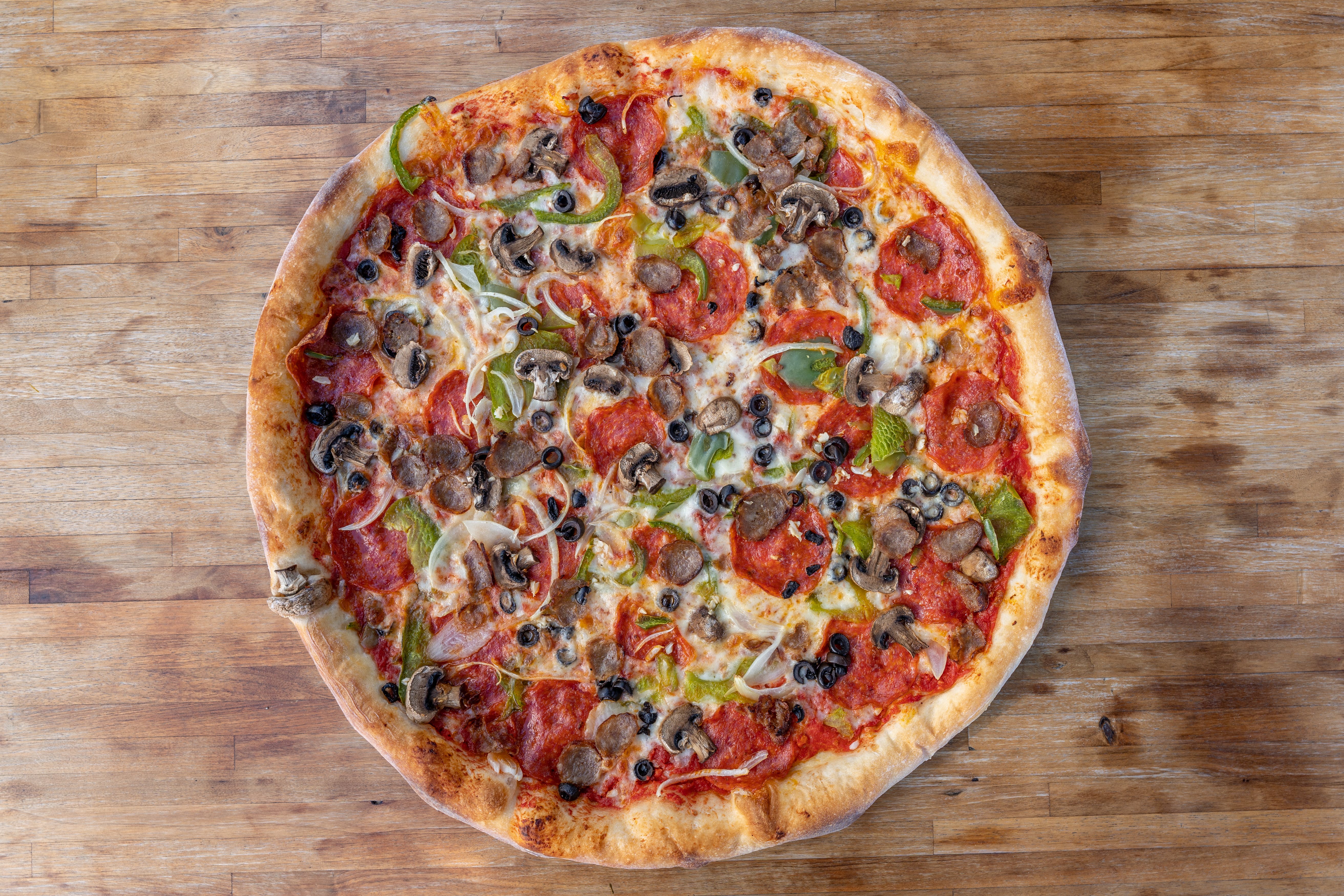 Order Supreme Pizza - 14'' food online from Ny Pizzeria Bonita store, Bonita on bringmethat.com