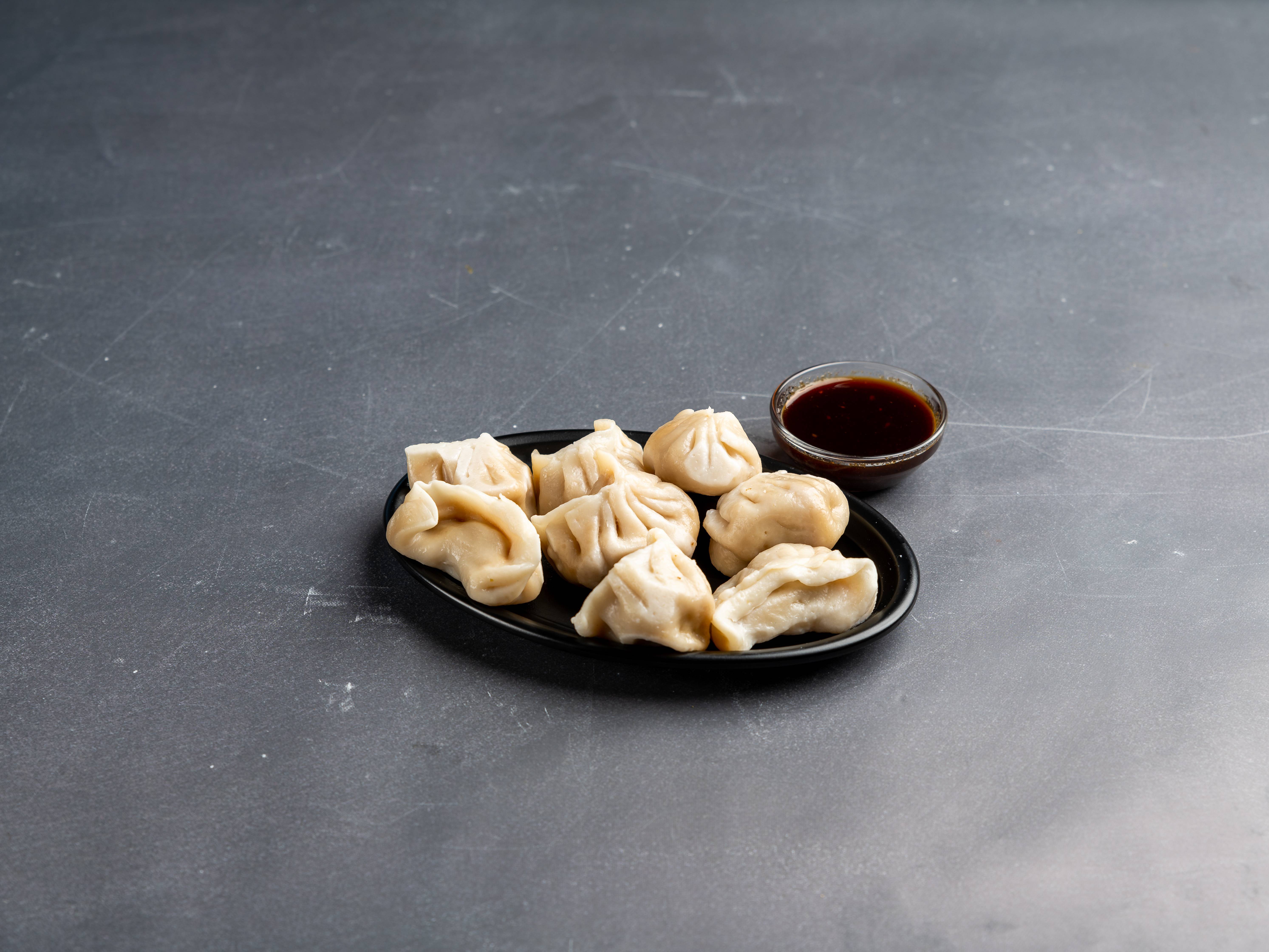 Order 10. Steamed Pork Dumplings food online from New China House store, Parkville on bringmethat.com