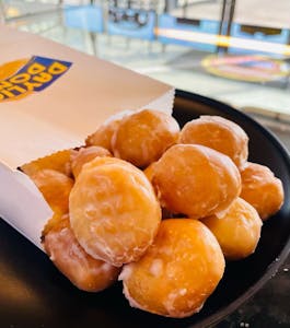 Order Donut Holes - Dozen food online from Daylight Donuts Op store, Overland Park on bringmethat.com