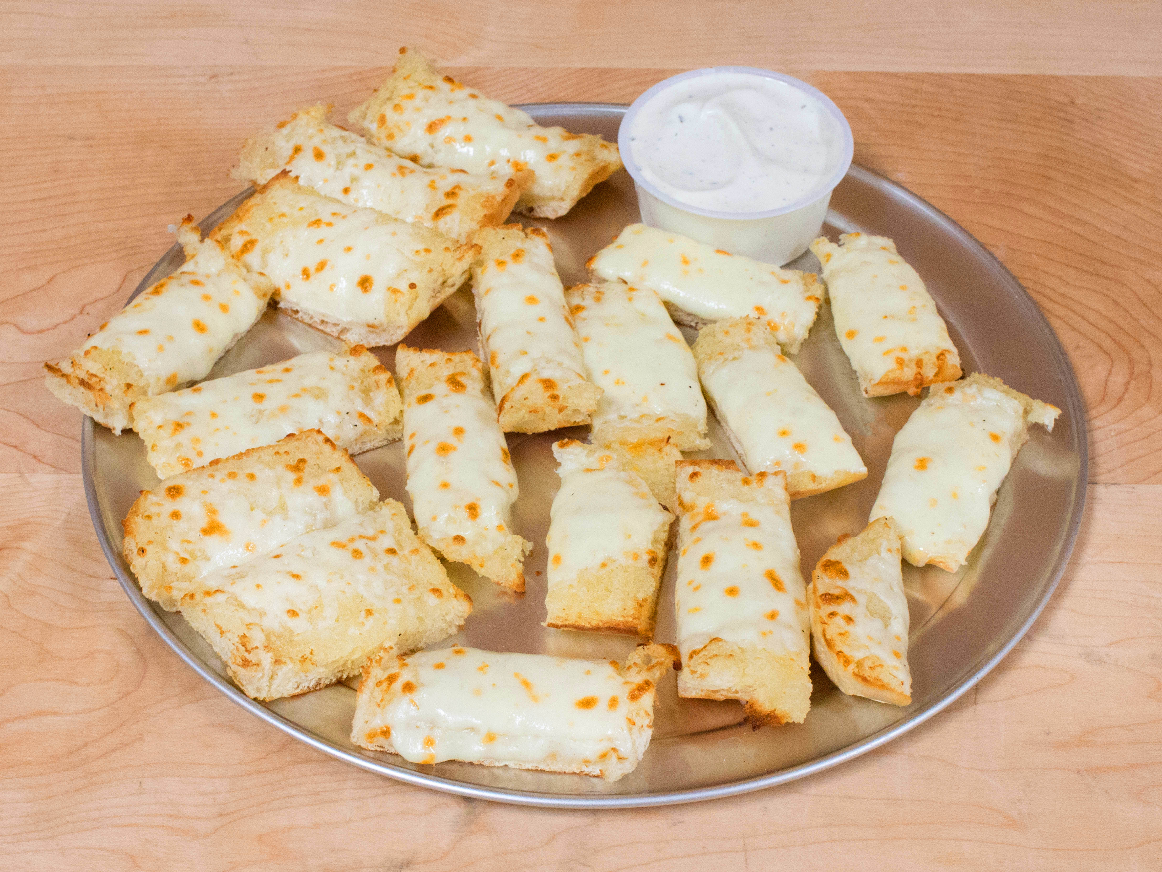 Order 9" Garlic Cheese Bread food online from Mancino's store, Lansing on bringmethat.com