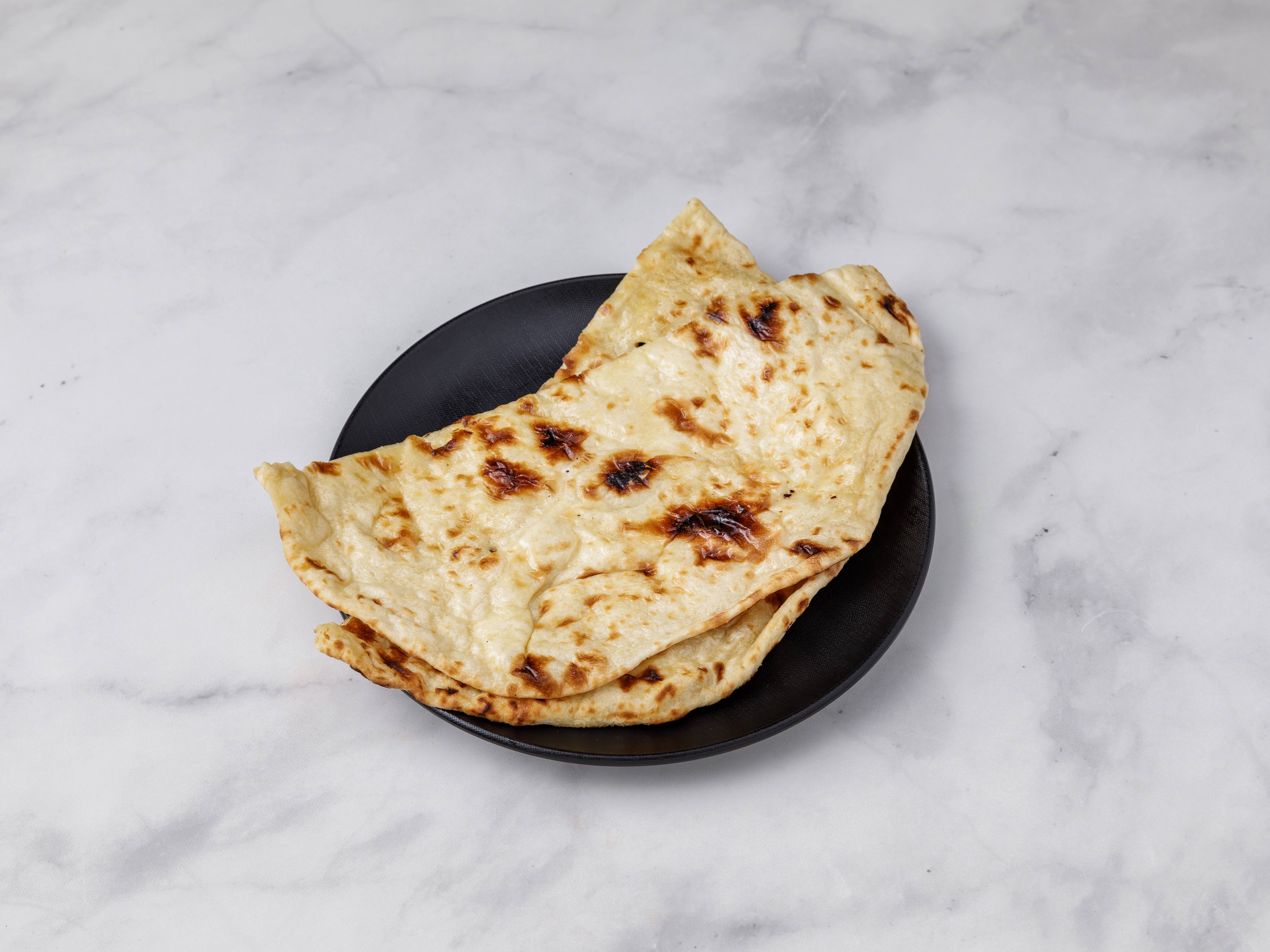 Order Butter Naan food online from Deccan Spice Authentic Indian Cuisine store, Roswell on bringmethat.com