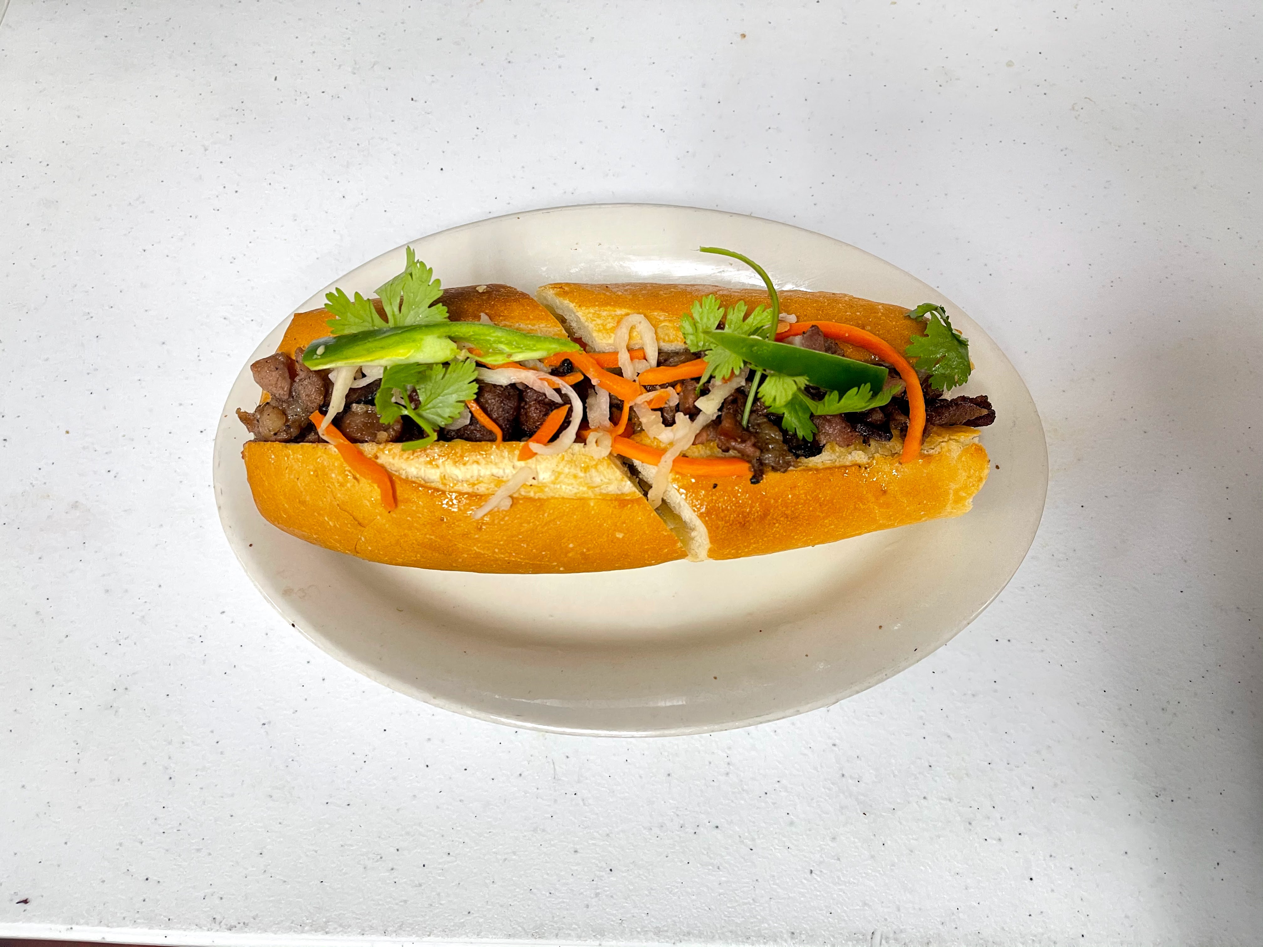 Order Banh Mi Thit Nuong - Grilled BBQ Pork Sandwich food online from Joyful House store, Saint Louis on bringmethat.com
