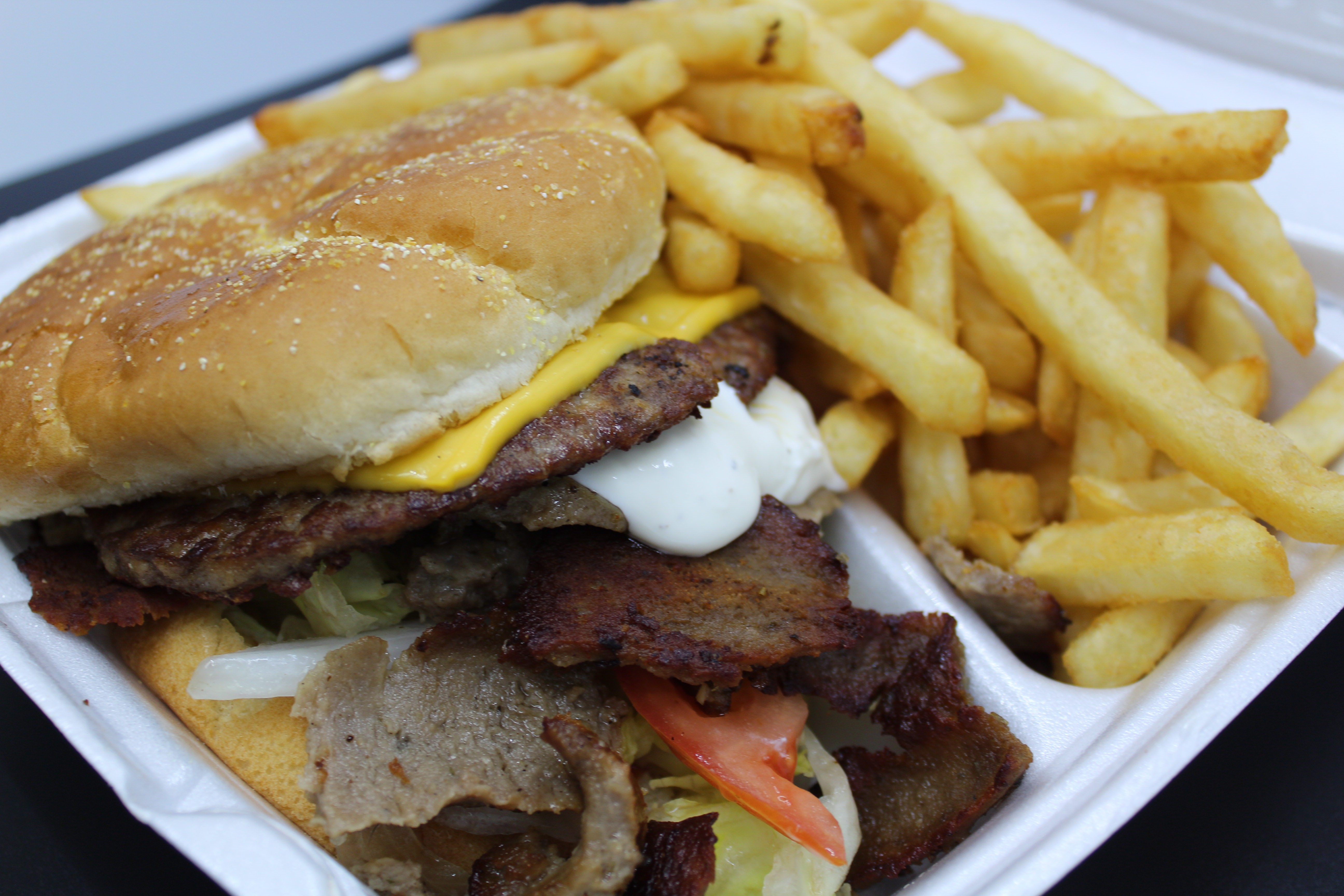 Order Double Gyro Cheeseburger with fries food online from Baba Steak And Lemonade store, Fort Wayne on bringmethat.com