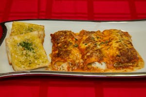 Order Homemade Cannelloni food online from Papa Ray's Pizza - Miriam St. store, Daly City on bringmethat.com