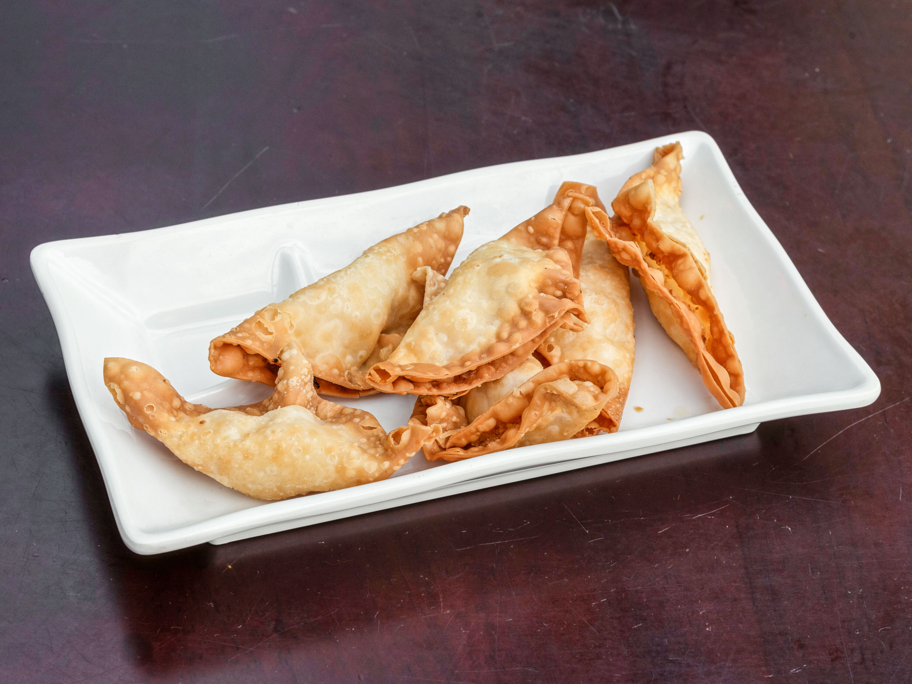 Order A2. Six Crab Rangoons food online from Thousand Crane store, Manchester on bringmethat.com