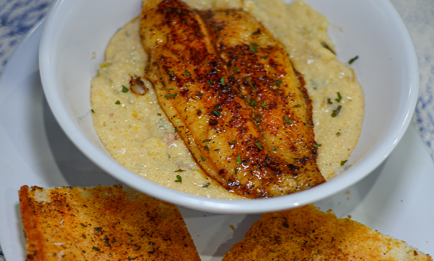 Order Fish N Grits food online from The Station Seafood Co. store, Houston on bringmethat.com