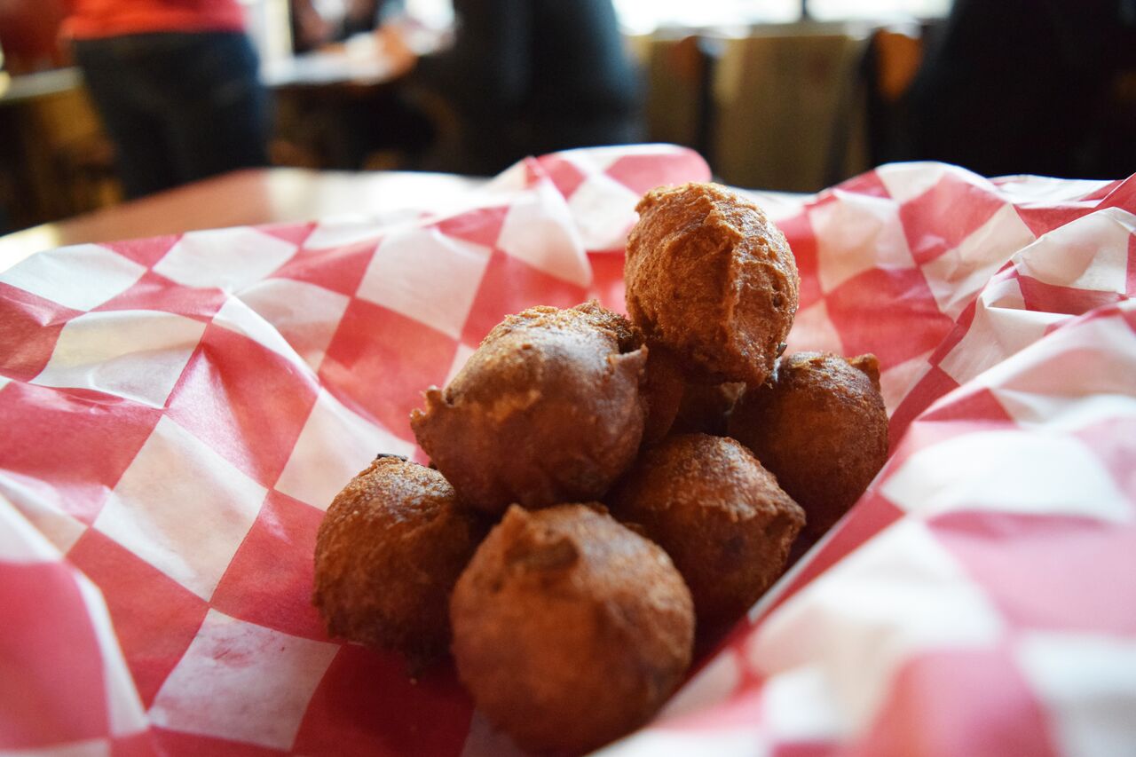 Order Basket of Hush Puppies food online from The Lost Cajun store, Fort Collins on bringmethat.com