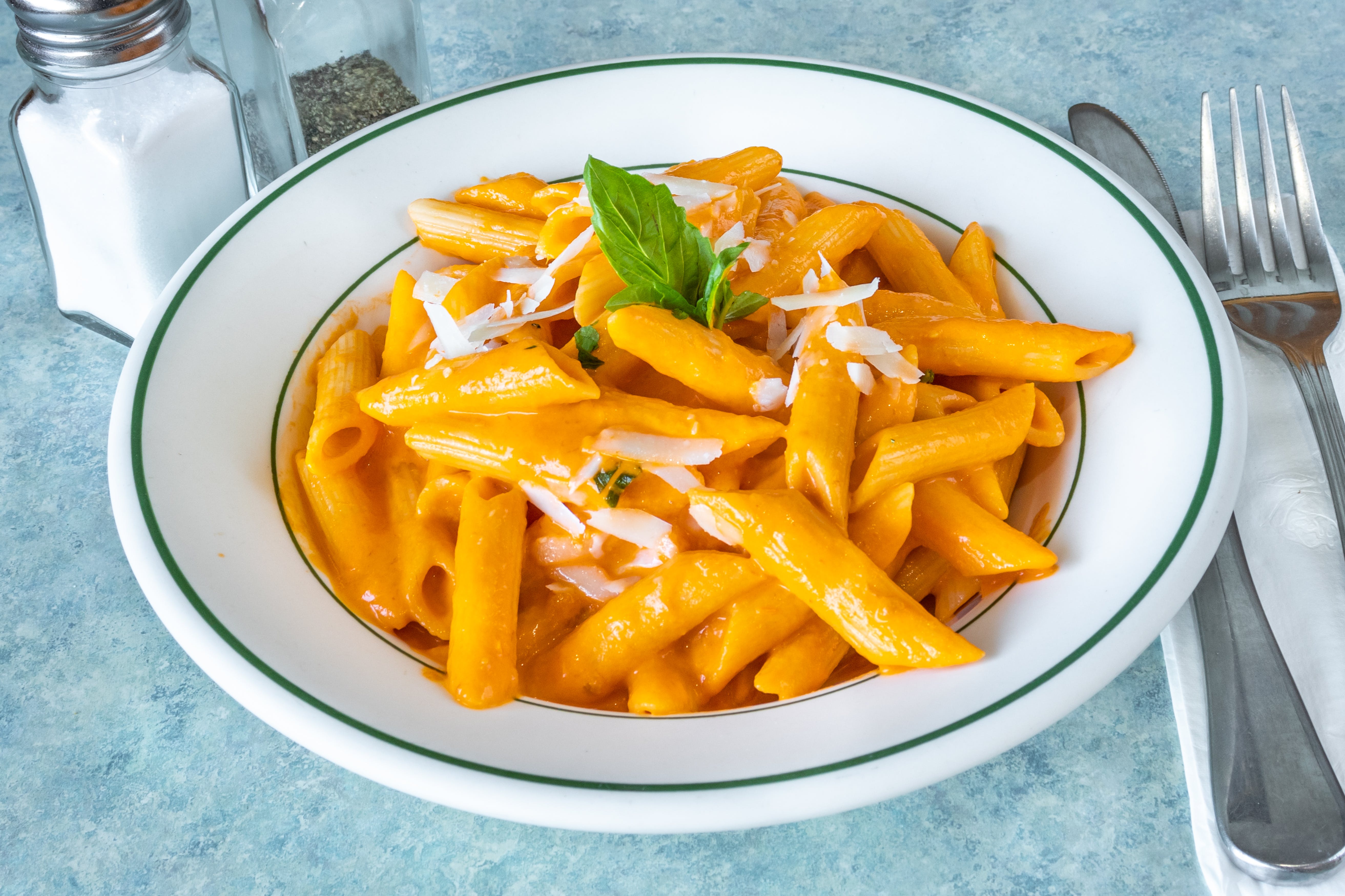 Order Penne with Vodka Sauce - Pasta food online from Sinapi Pizzeria store, Brewster on bringmethat.com