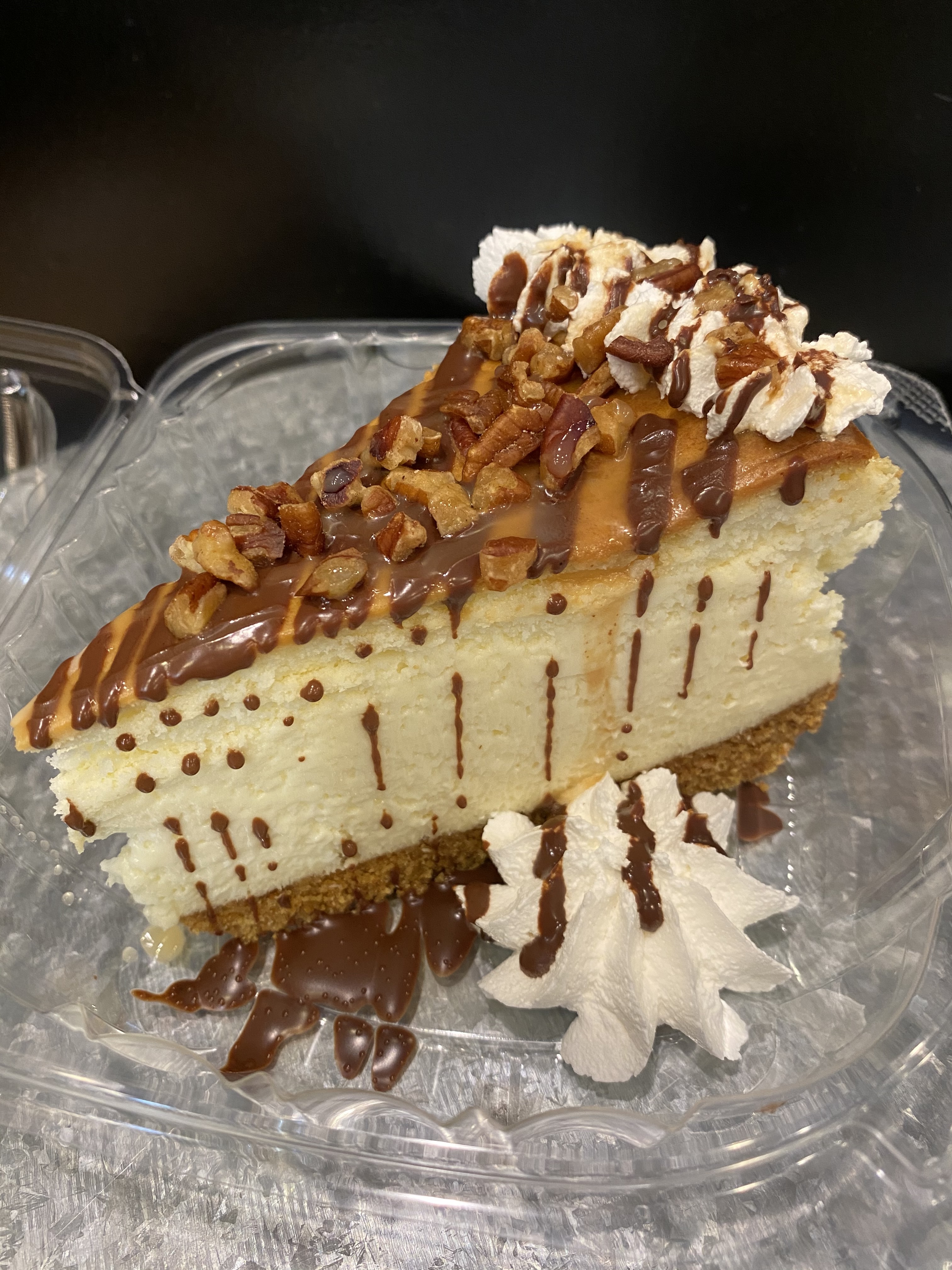 Order Turtle Cheesecake Slice food online from Sweet Tooth store, Fayetteville on bringmethat.com