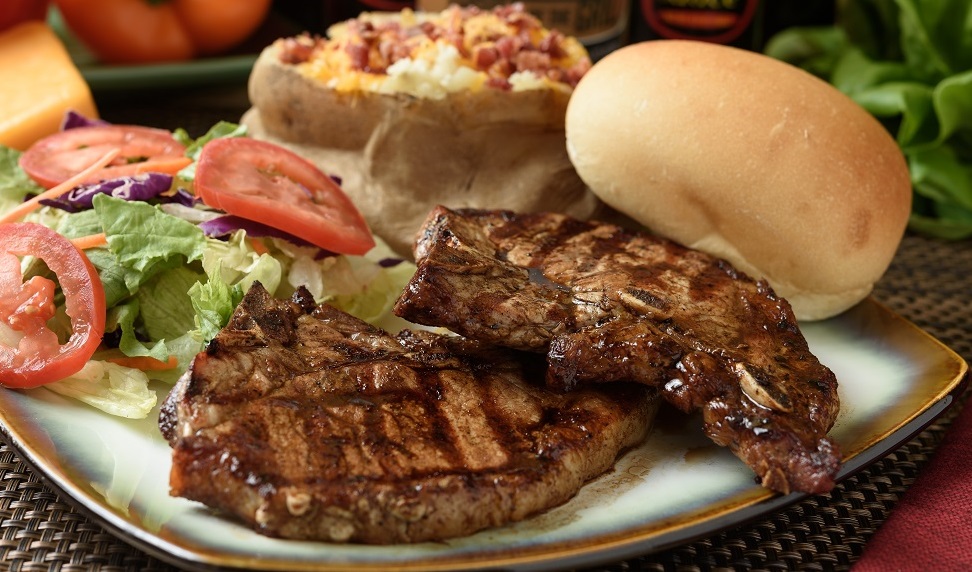 Order 2-6 oz. Grilled Pork Chop food online from Steak-Out store, Columbus on bringmethat.com