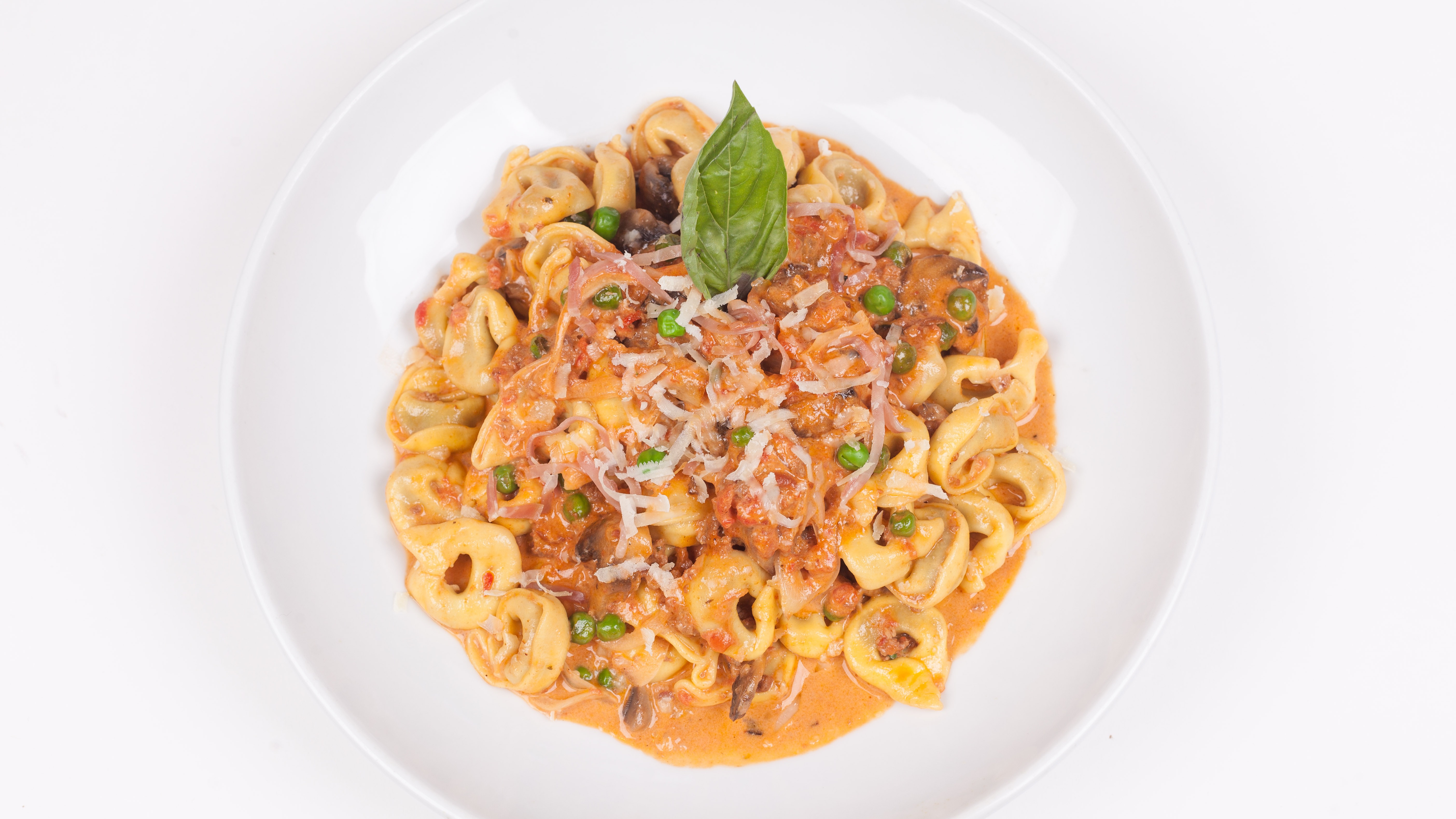 Order Tortellini Bolognese food online from Umberto's Pizzeria store, New Hyde Park on bringmethat.com