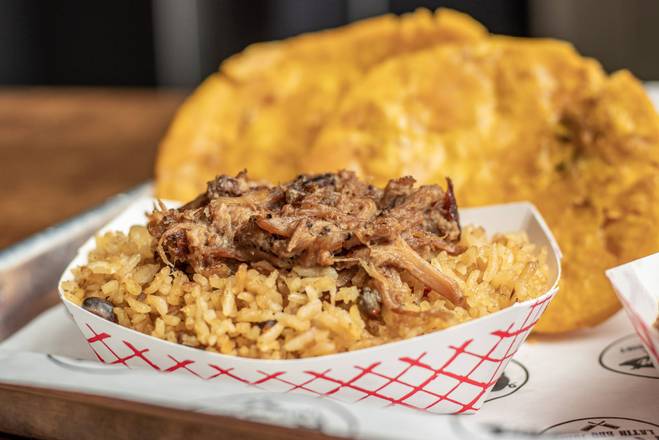 Order Lechon Rice (Arroz con Gandules y Lechon) food online from Lechon Latin BBQ Joint store, Raleigh on bringmethat.com