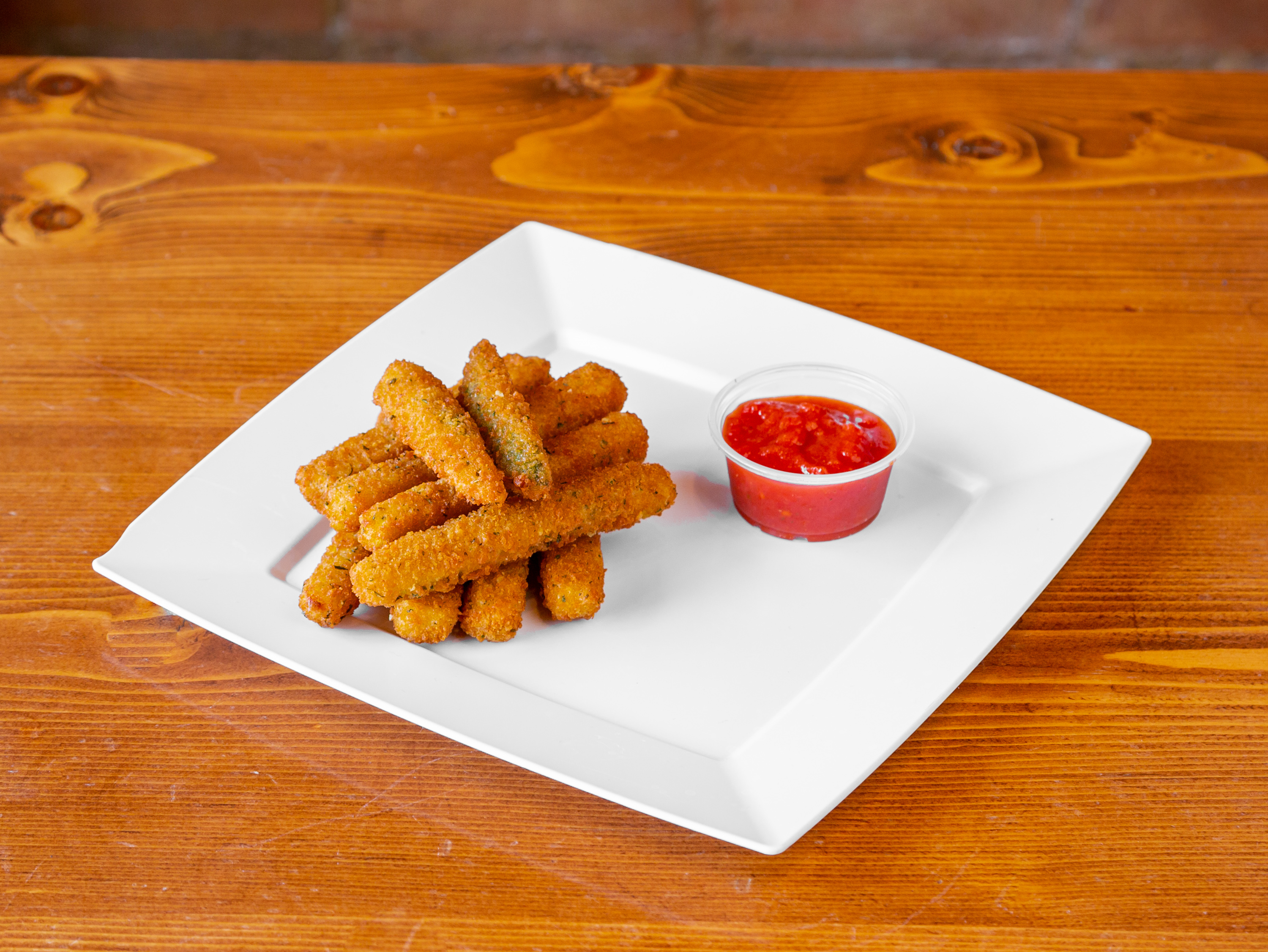 Order Zucchini Sticks food online from Bada Bing Pizza store, Painesville on bringmethat.com