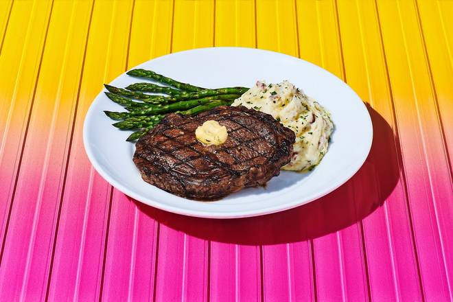 Order NEW! 14-oz. Ribeye* food online from Dave & Buster's store, Columbia on bringmethat.com