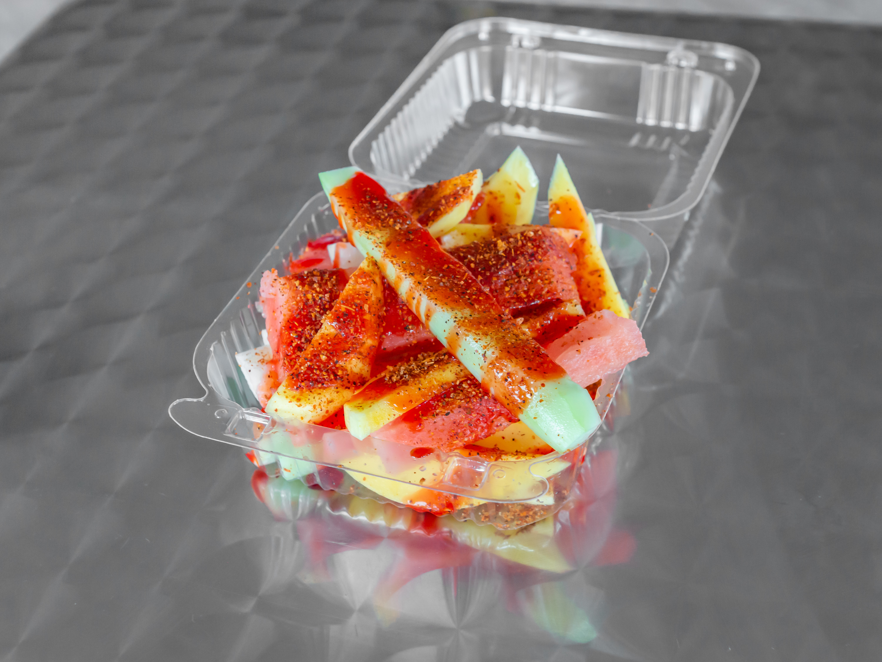 Order Mixed Fruit with chamoy and chili lime food online from Diamonds Ice Cream store, Columbus on bringmethat.com