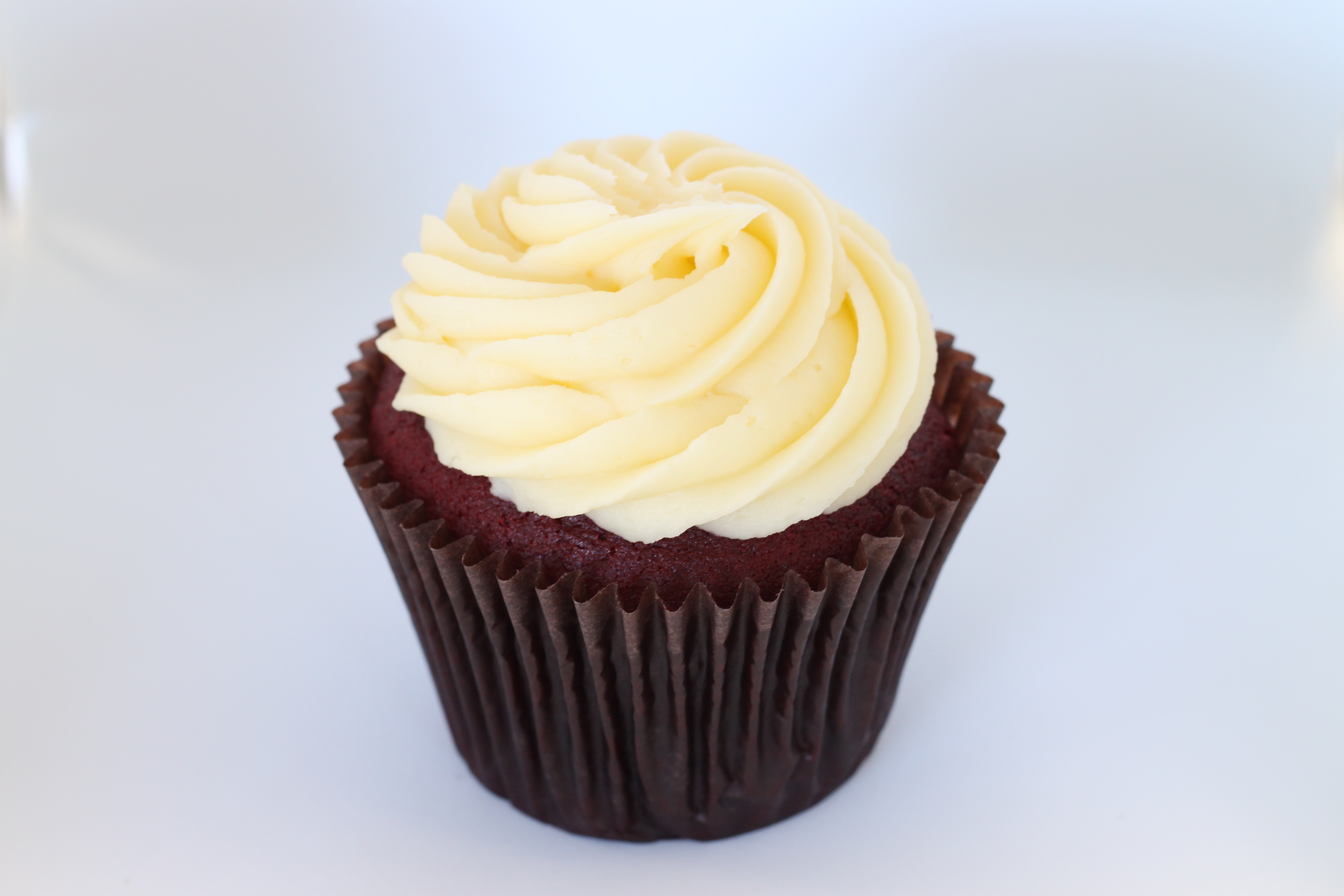 Order Famous Red Velvet Cupcake food online from Smallcakes Cupcakery And Creamery store, Garhanna on bringmethat.com