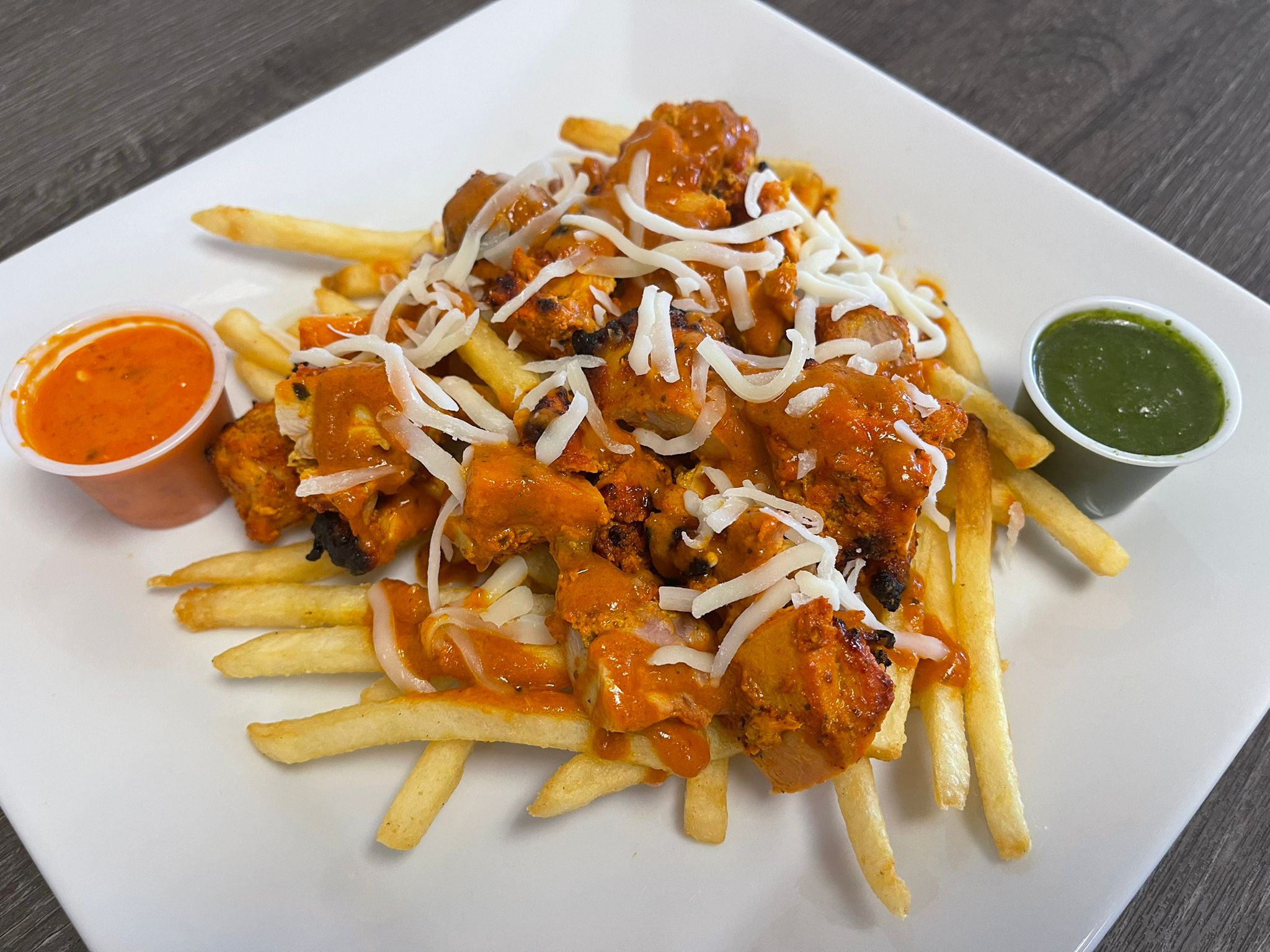Order Chicken Tikka Poutine food online from Fresh Curry Chefs store, Camarillo on bringmethat.com