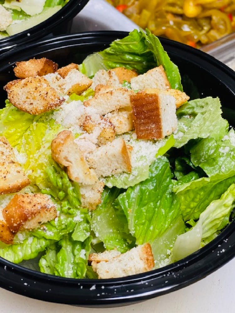 Order Caesar Salad - Large food online from Golden Crust Pizzeria store, Philadelphia on bringmethat.com