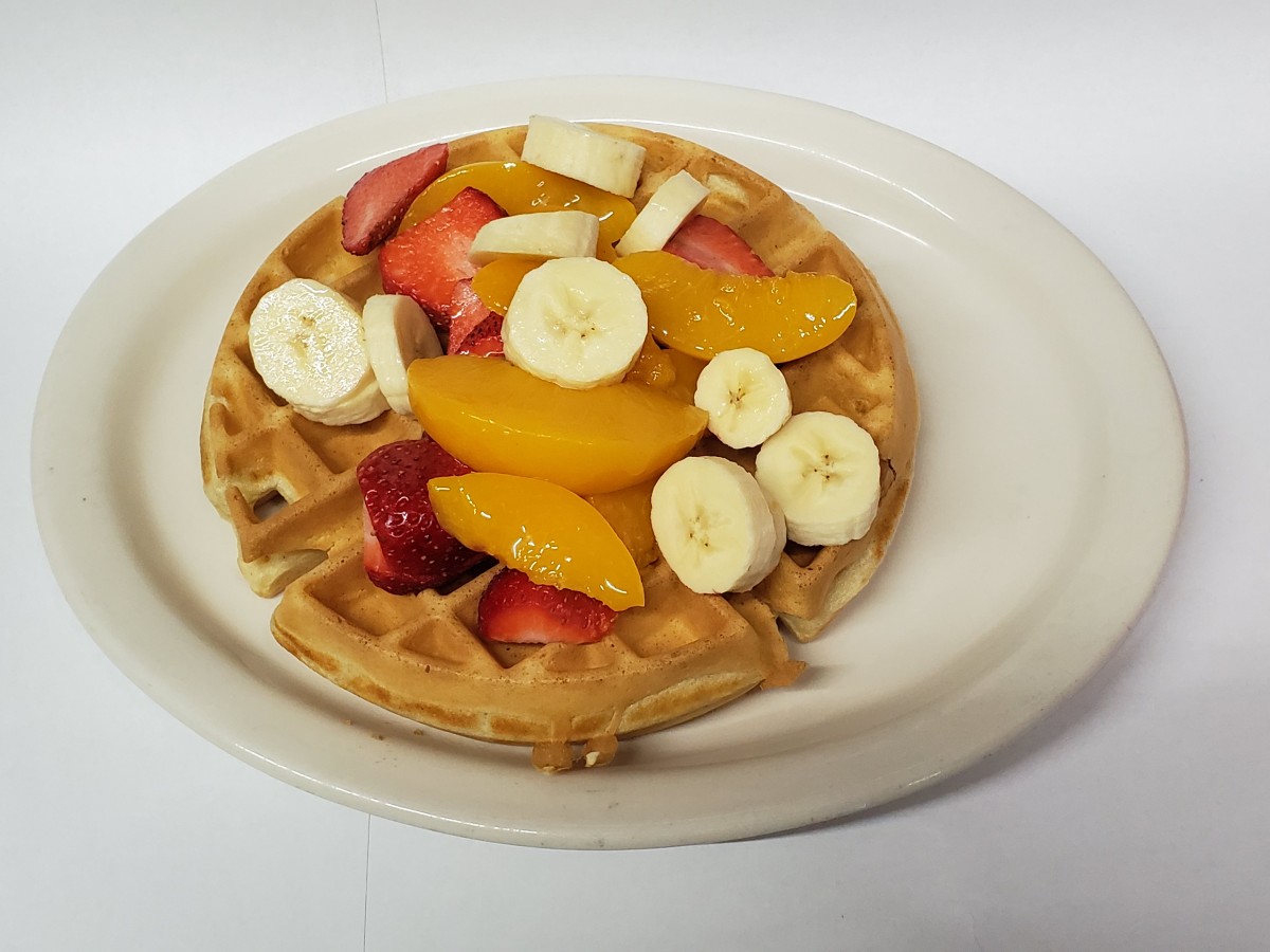 Order Tropical Waffle with Banana, Strawberries, and Peaches food online from Sunrise Diner store, Roselle Park on bringmethat.com
