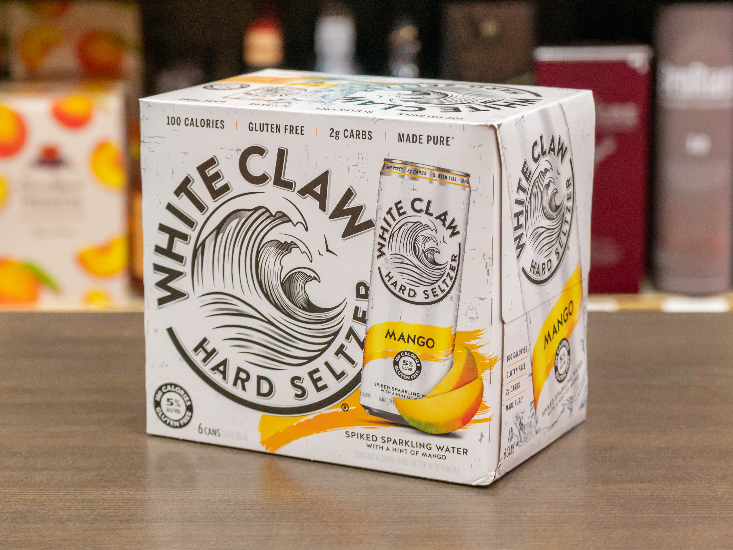 Order 12 Pack - 12 oz. Can of White Claw Mango Hard Seltzer (5.0% ABV) food online from Burlingame Liquor store, Burlingame on bringmethat.com