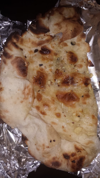 Order Flavored Naan food online from Kismat store, New York on bringmethat.com