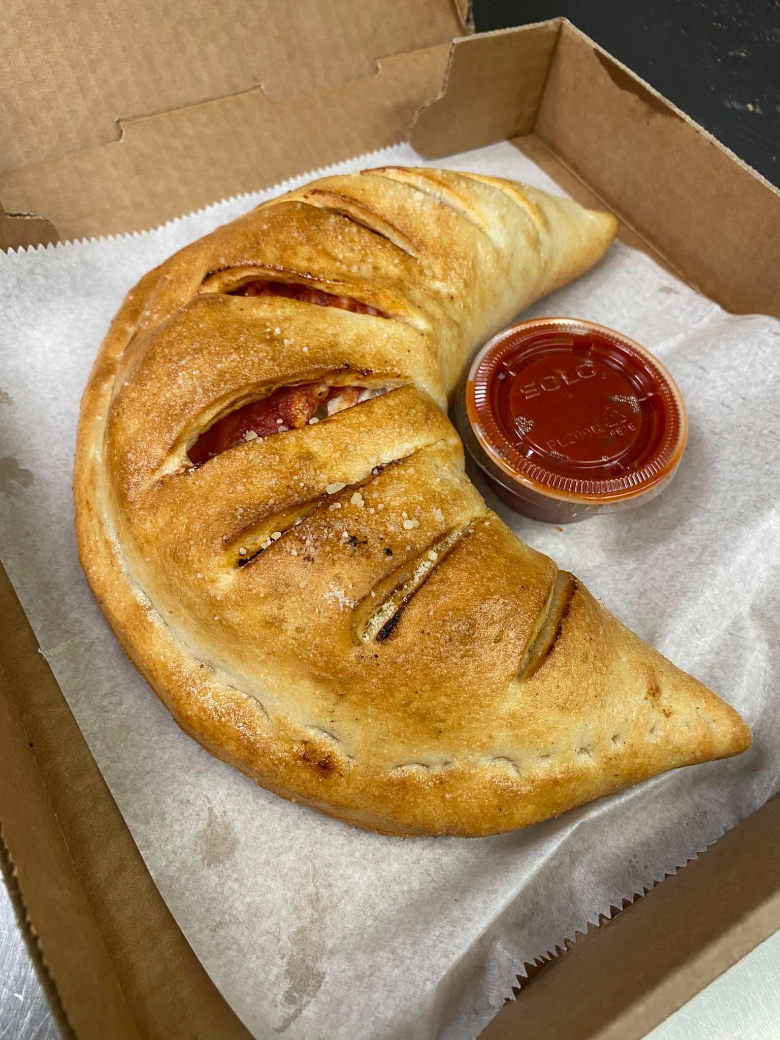 Order Calzone - Calzone food online from Primo Pizza store, Fredericksburg on bringmethat.com