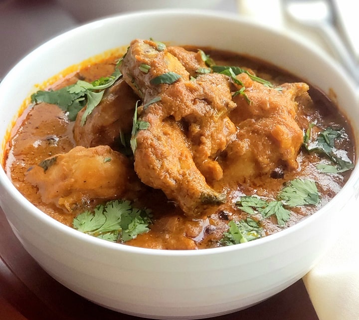 Order Andhra Chicken Curry food online from Tamarind Indian Cuisine store, Sterling on bringmethat.com