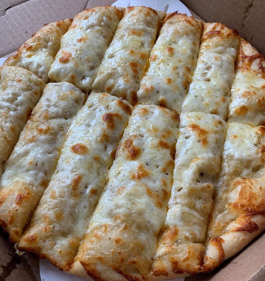 Order Breadsticks with Cheese - Breadstick food online from Novotny's Groceries & Pizza store, Worthington on bringmethat.com