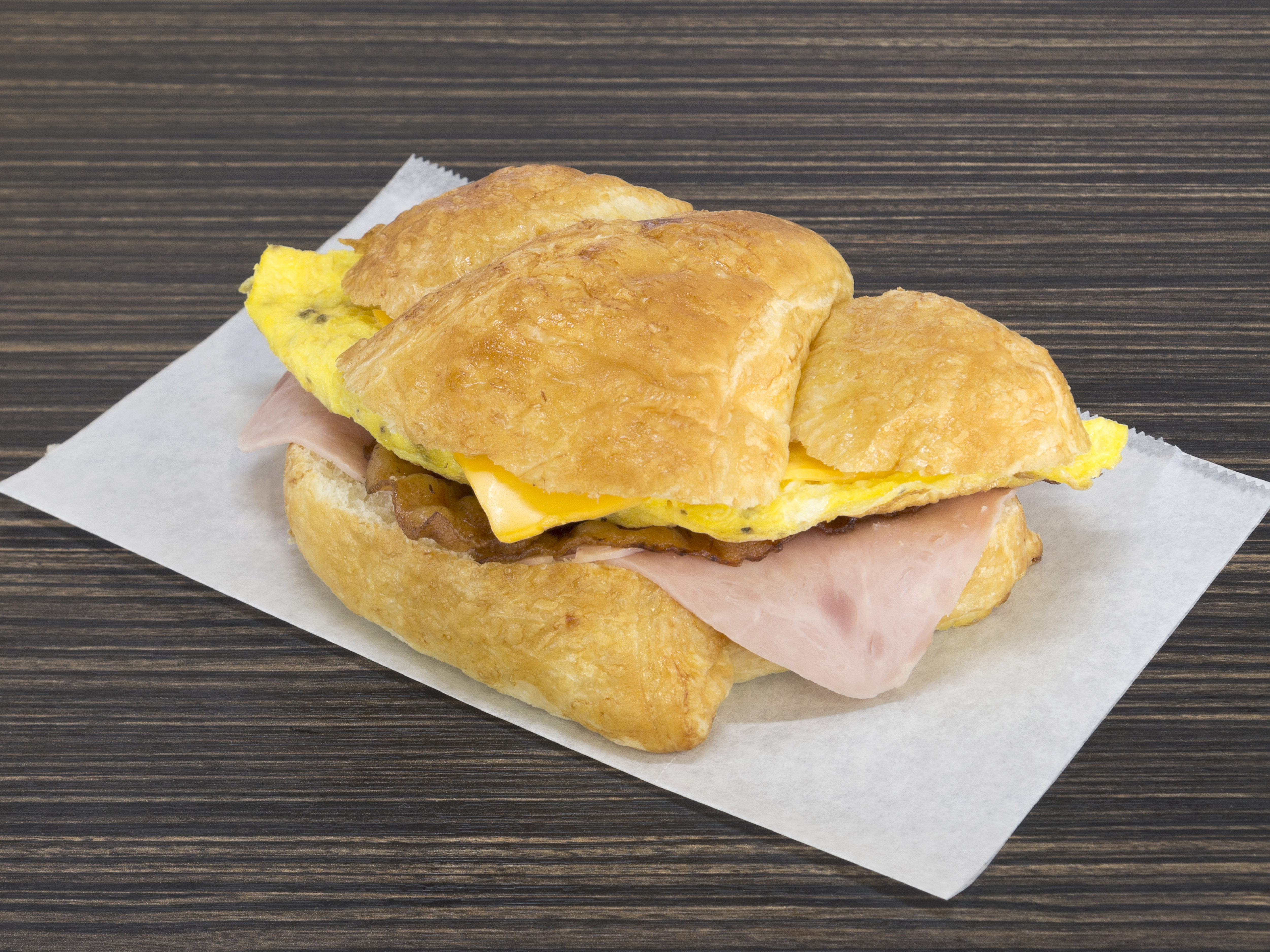 Order Ham, Egg, Bacon and Cheese Croissant Breakfast food online from Red Oak Donuts store, Red Oak on bringmethat.com