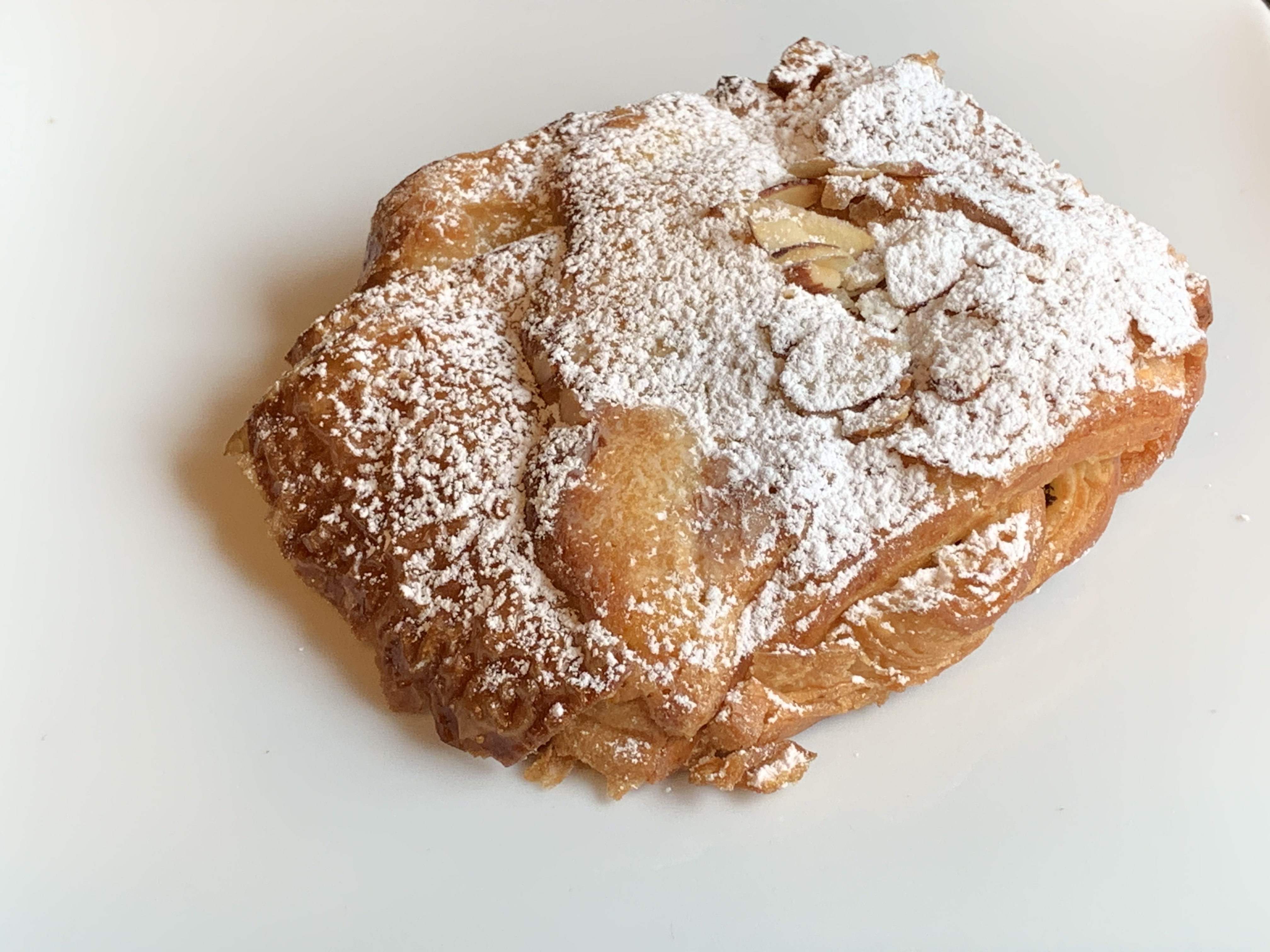 Order Almond Croissant food online from Romeo And Juliet Coffee store, New York on bringmethat.com