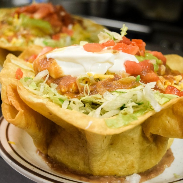 Order Flowering Tostada food online from Tio's Mexican Food - Day Creek store, Rancho Cucamonga on bringmethat.com
