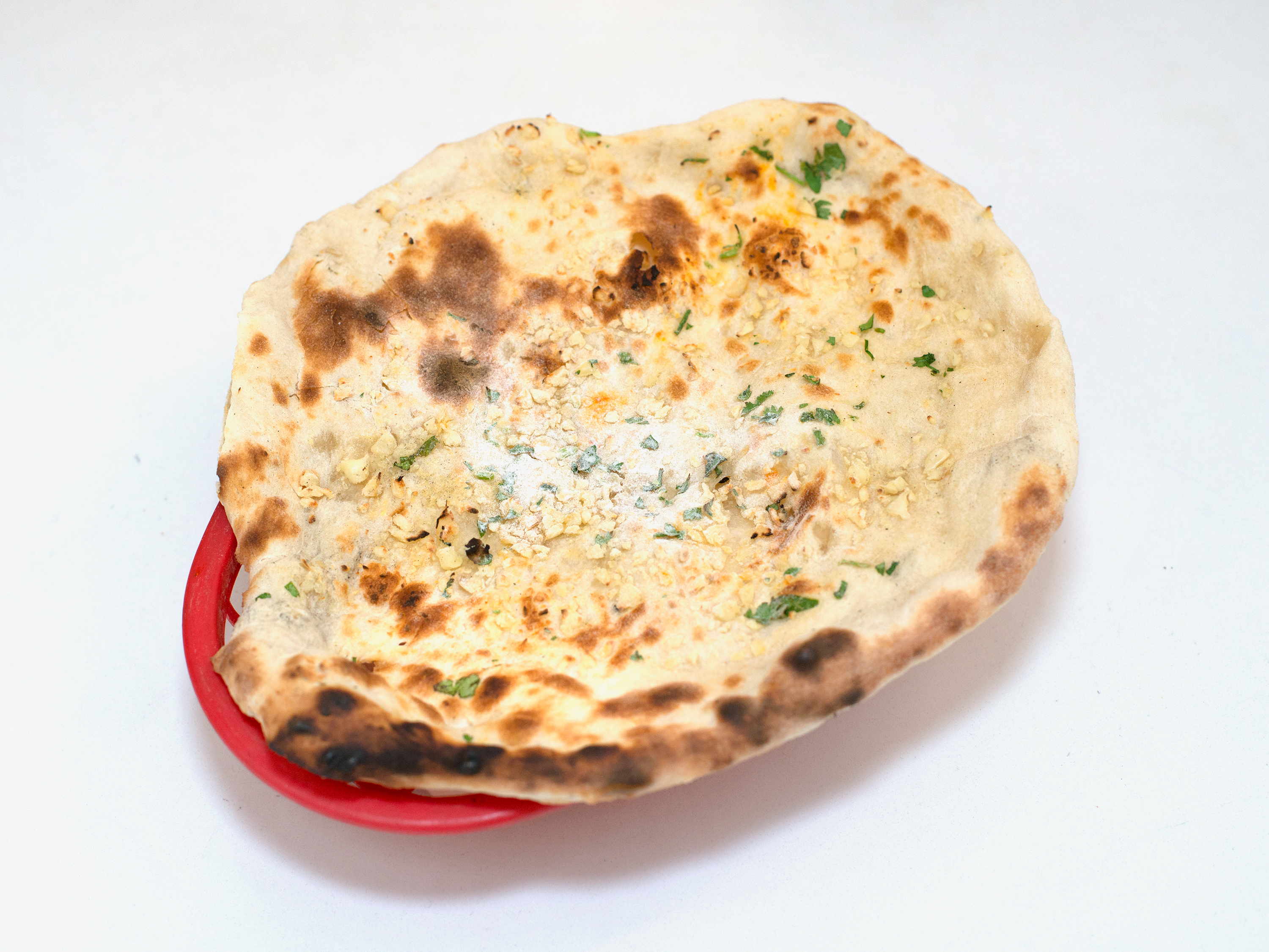 Order Garlic Naan food online from Ghandi Cafe store, New York on bringmethat.com