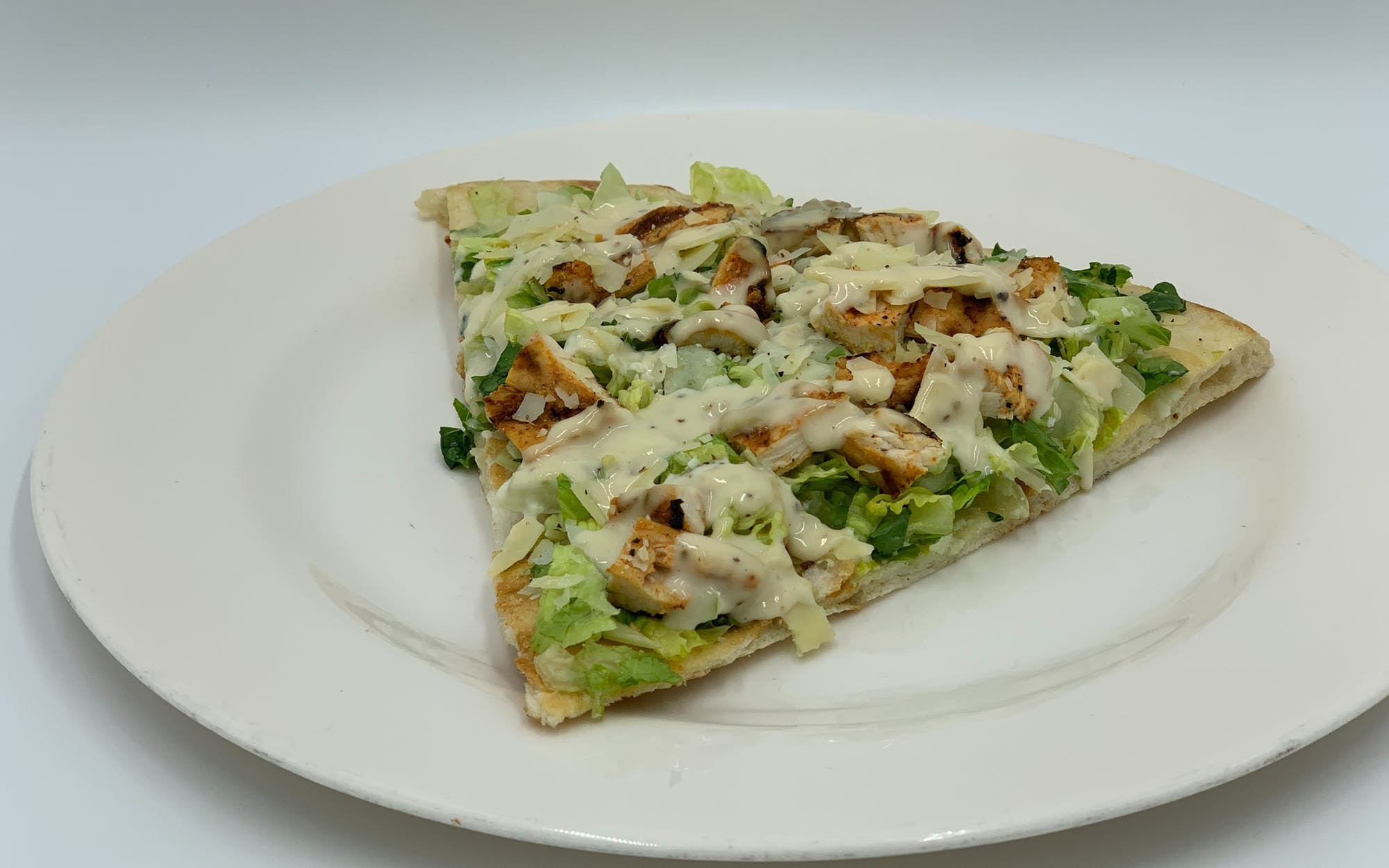 Order Caesar Salad with Grilled Chicken Pizza - Personal food online from Mario Pizza store, Westbury on bringmethat.com