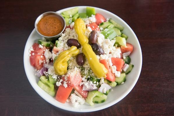 Order Greek Salad food online from Soprano's Pizza & Pasta store, Seattle on bringmethat.com