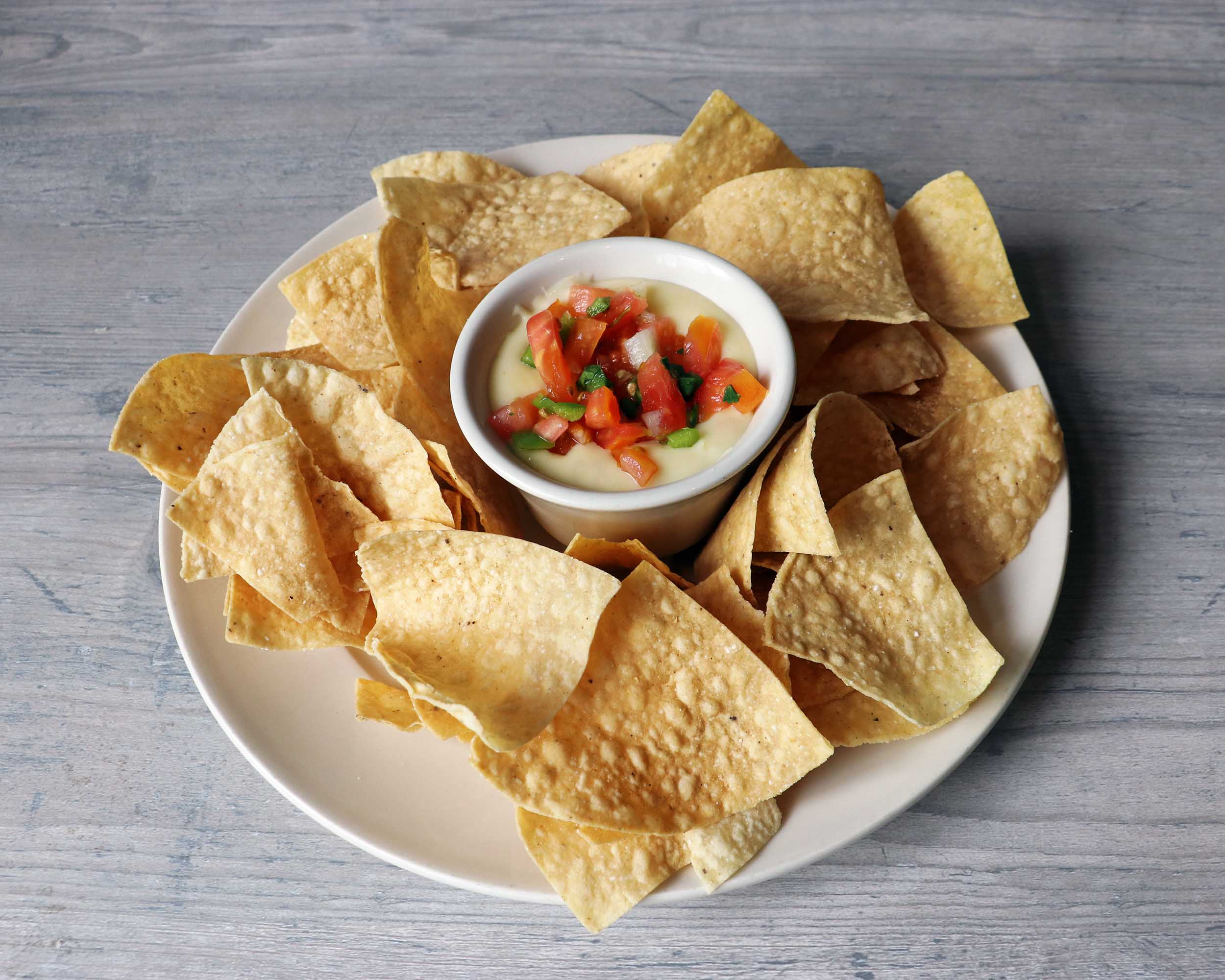 Order Queso Cheese Dip food online from Scotty's brewhouse store, Bloomington on bringmethat.com