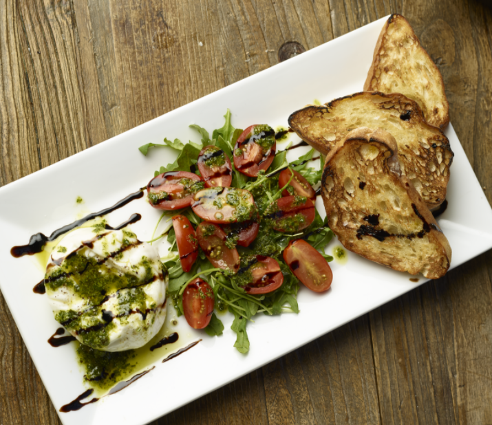 Order Burrata + Tomatoes with Pesto food online from Rise Pizzeria store, Burlingame on bringmethat.com