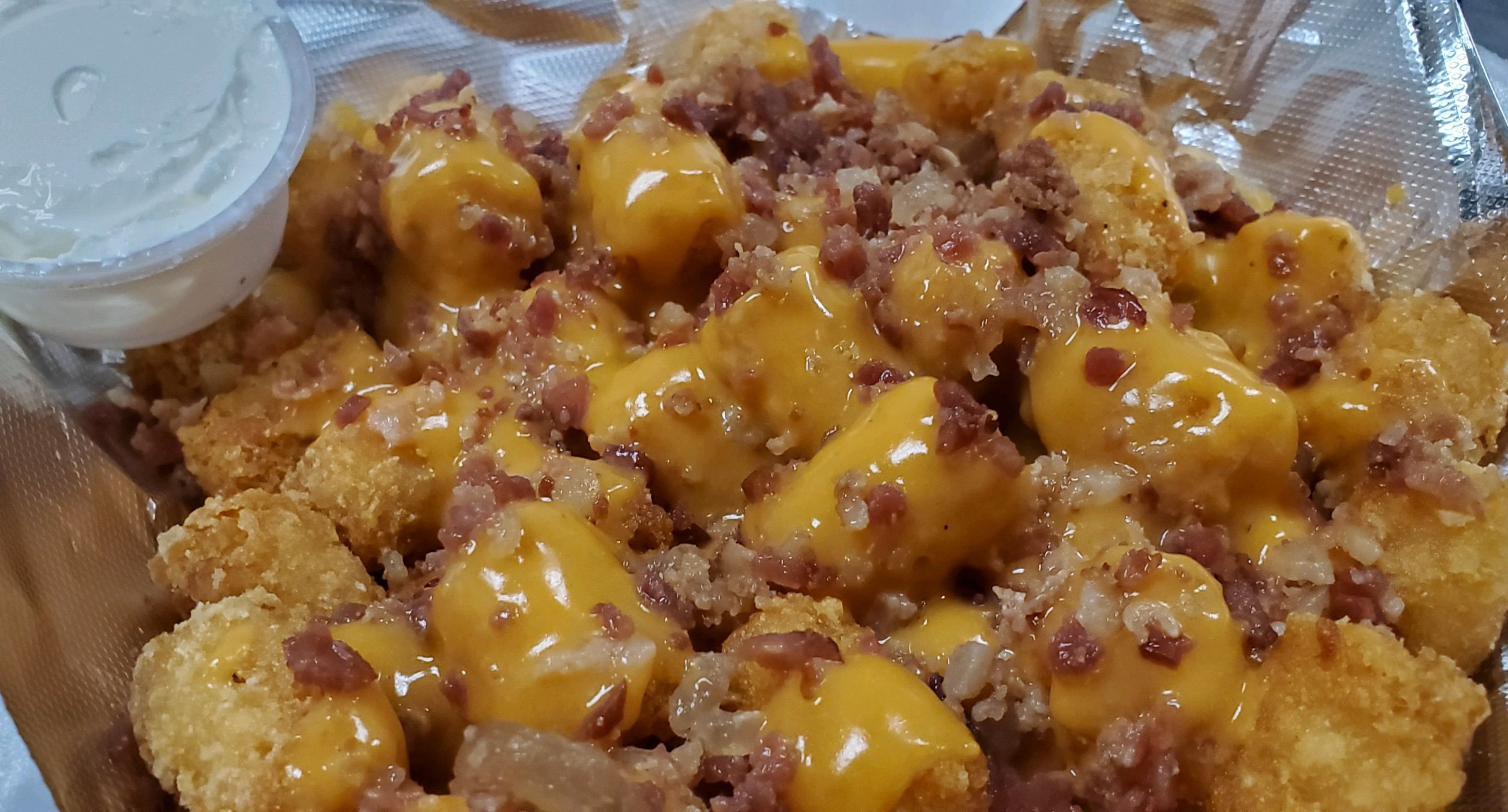 Order Loaded Tots food online from Knuckles Knockout Grill store, Rochester on bringmethat.com