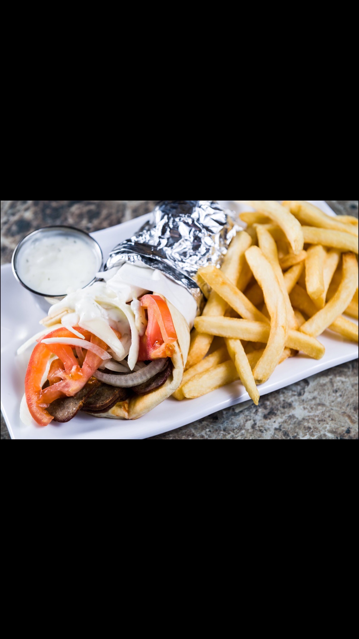 Order Saturday | Gyro with Fries & Medium Drink food online from Boston Pizza store, Las Vegas on bringmethat.com