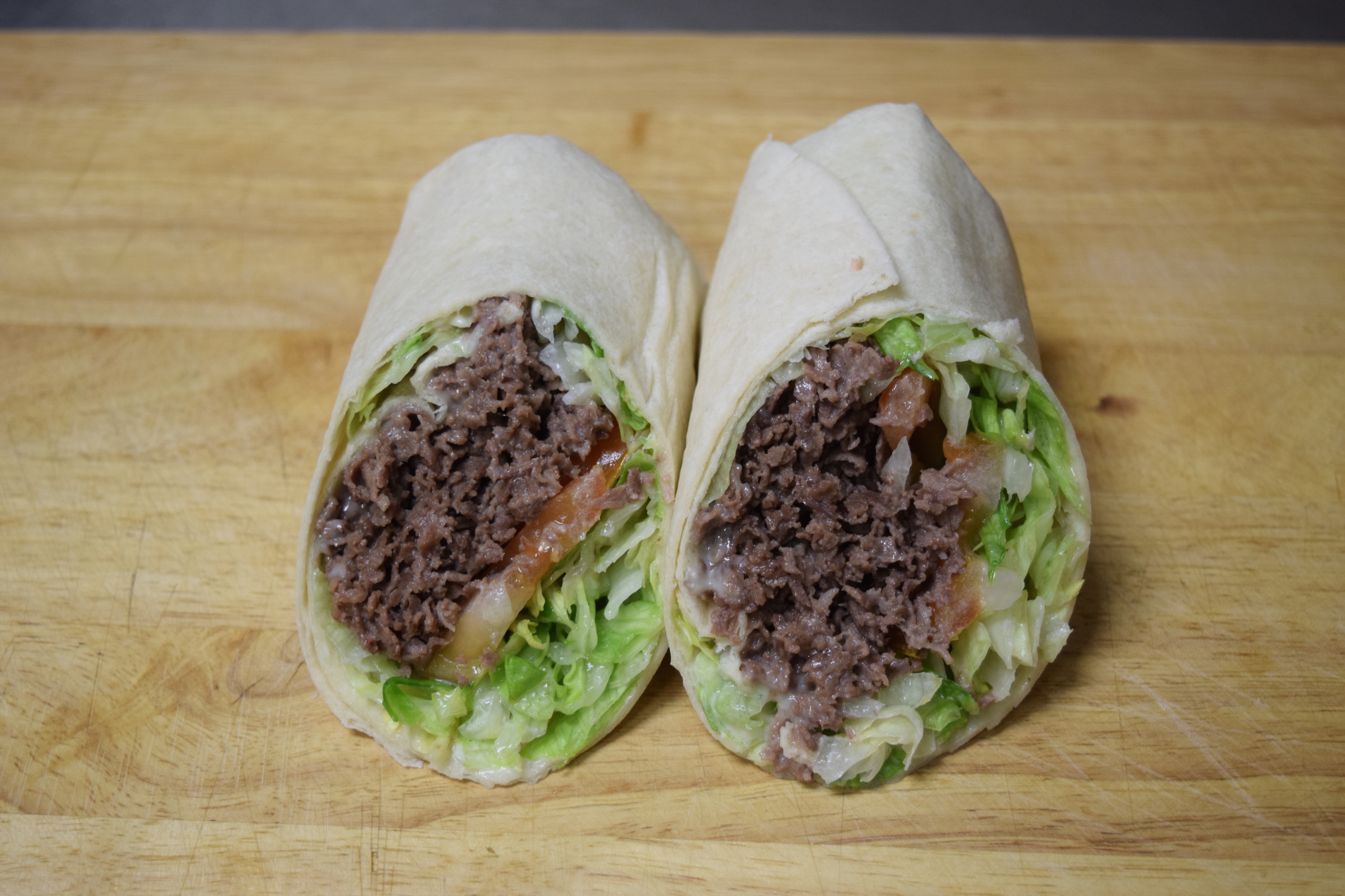 Order Cheese Steak Wrap food online from Cuzino's store, Bear on bringmethat.com