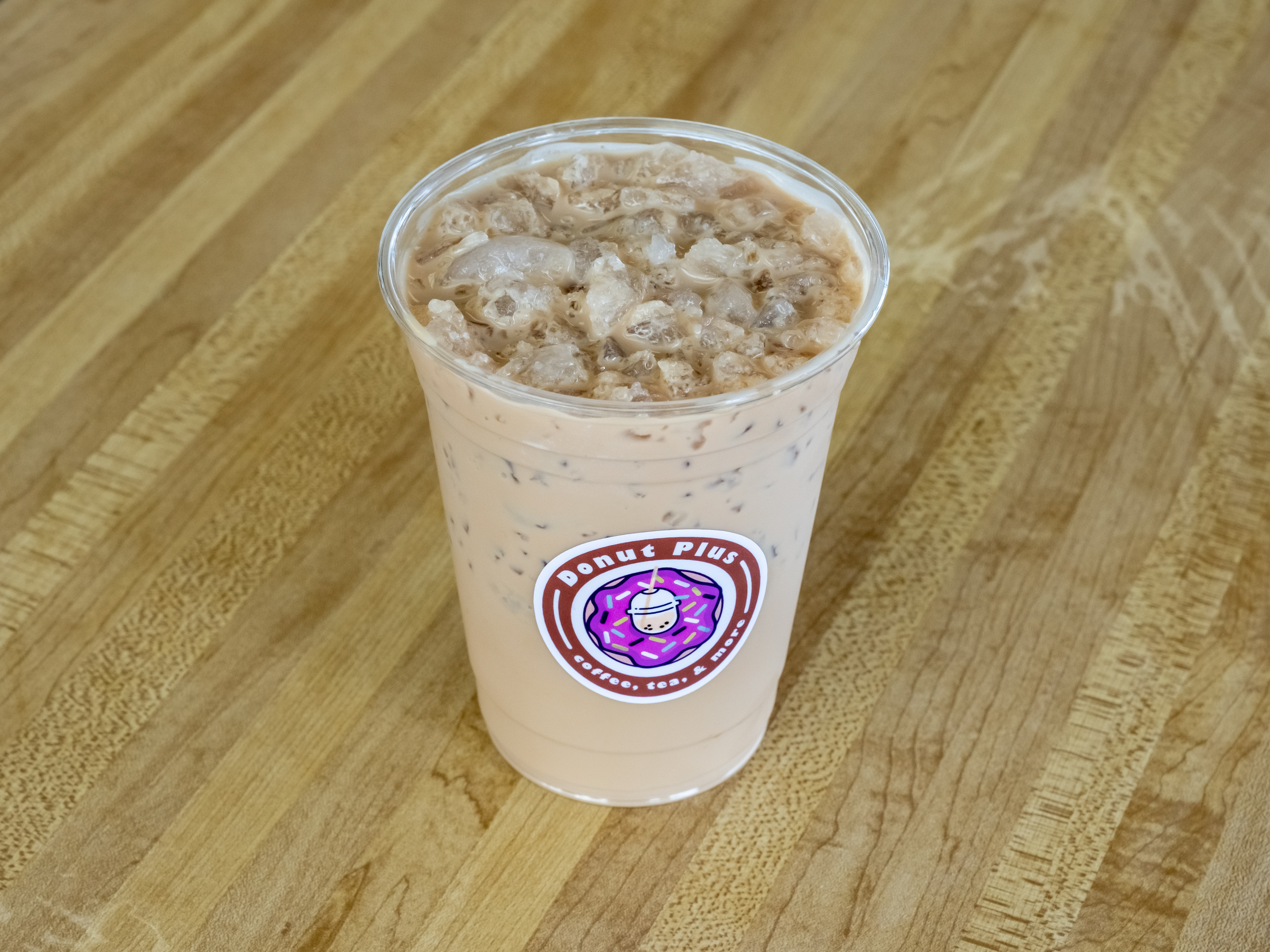Order Iced Coffee food online from Donut Plus store, Orange on bringmethat.com