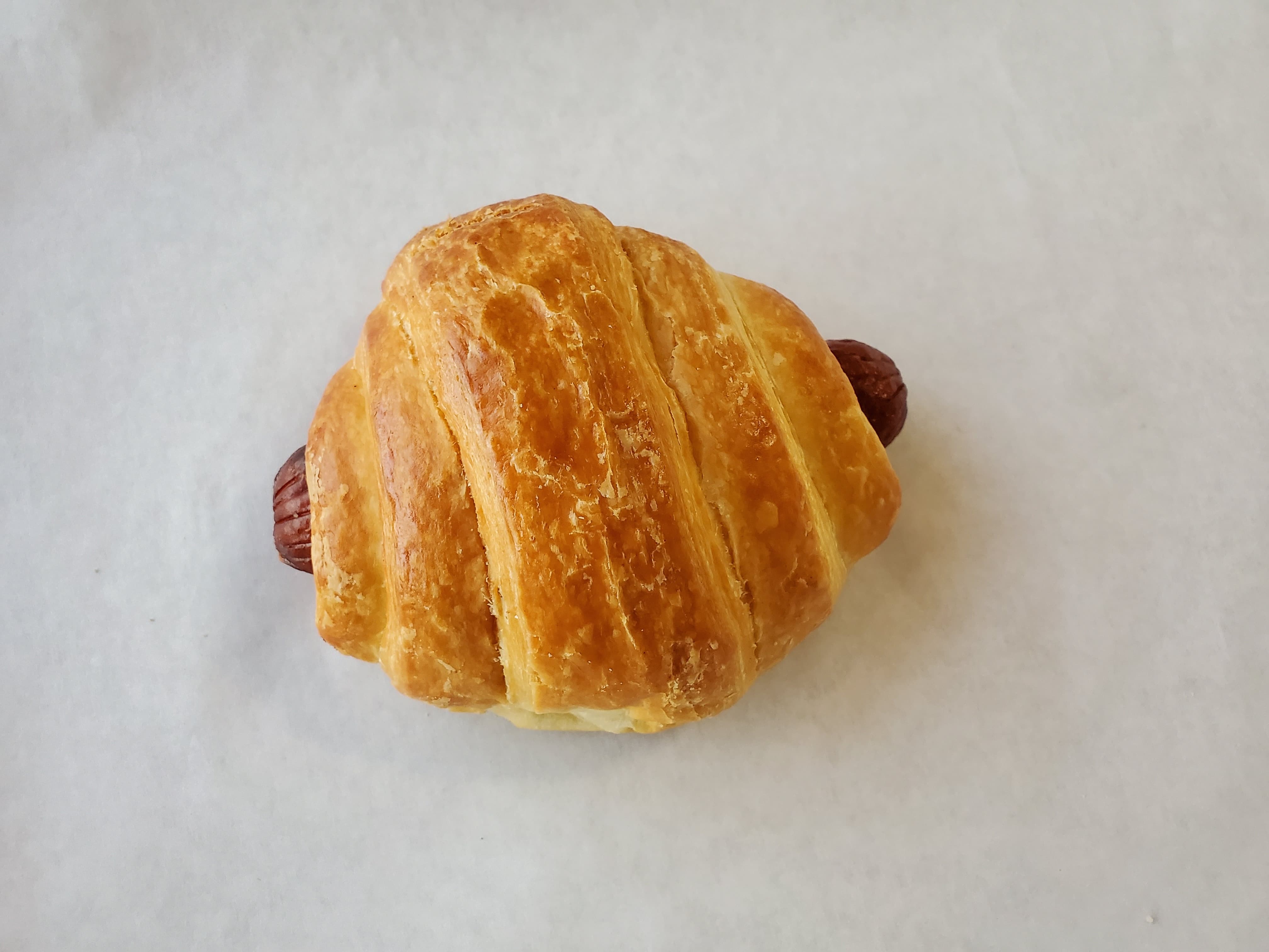 Order Small Sausage Roll Croissant food online from Honey Donuts store, Crowley on bringmethat.com