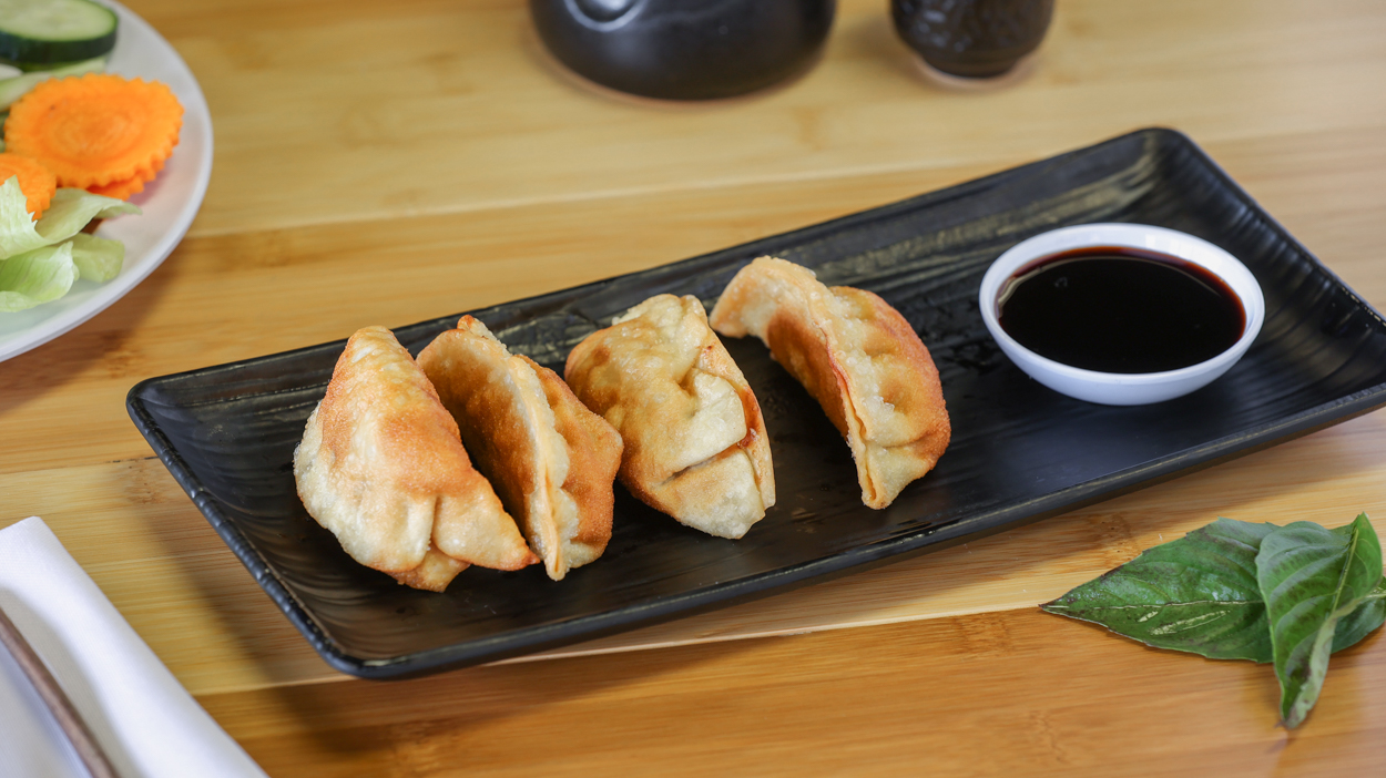 Order Pot Stickers (4) - sushi food online from Pho Cafe Hong Kong Diner store, Reno on bringmethat.com