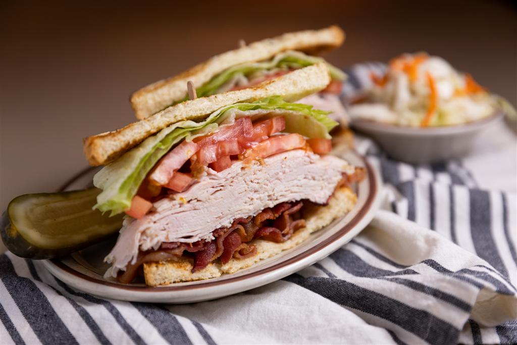 Order Turkey Club Sandwich   food online from Art's Delicatessen store, Studio City on bringmethat.com