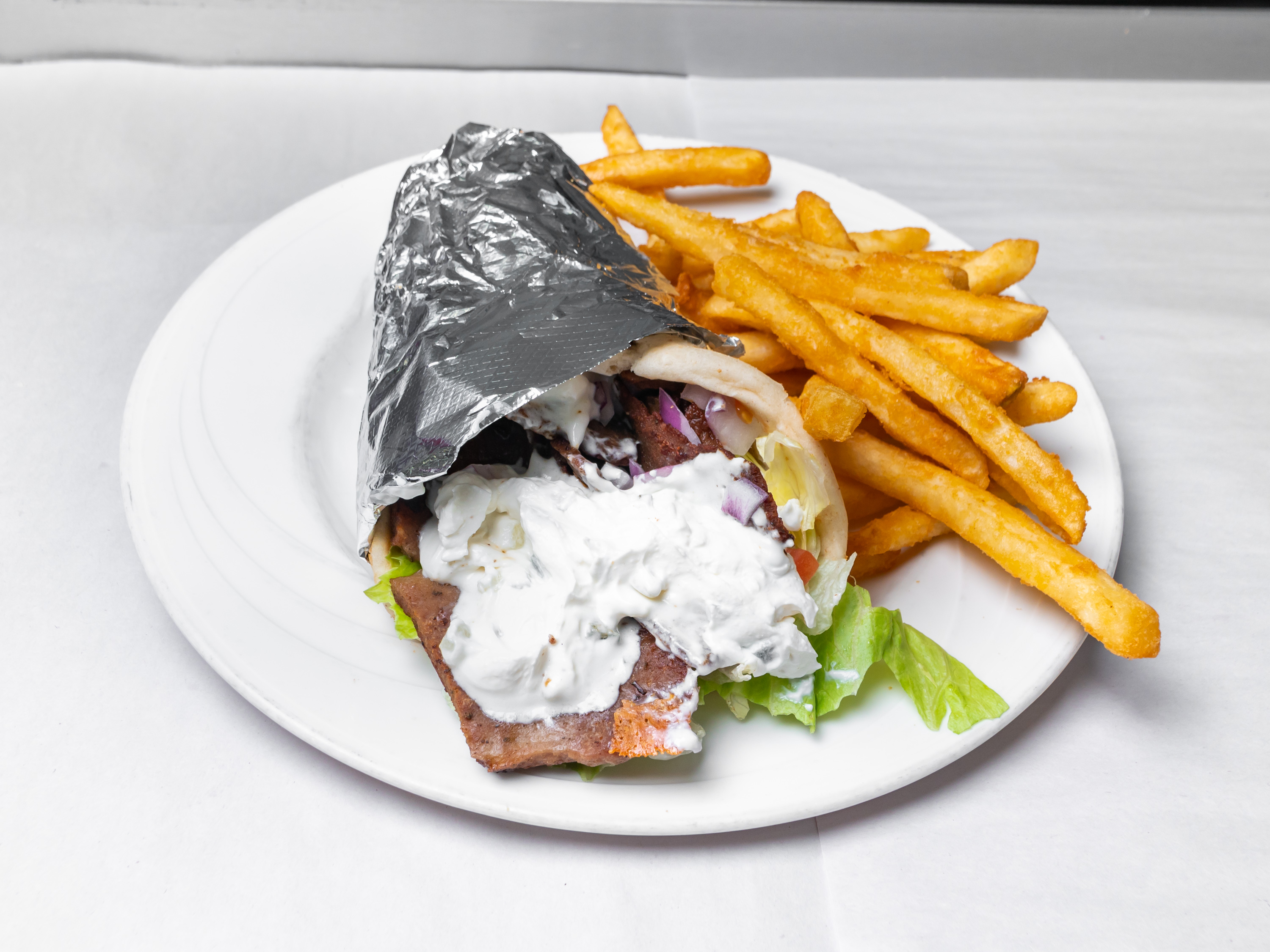 Order Gyro on Pita Chicken food online from The Spot store, Baltimore on bringmethat.com