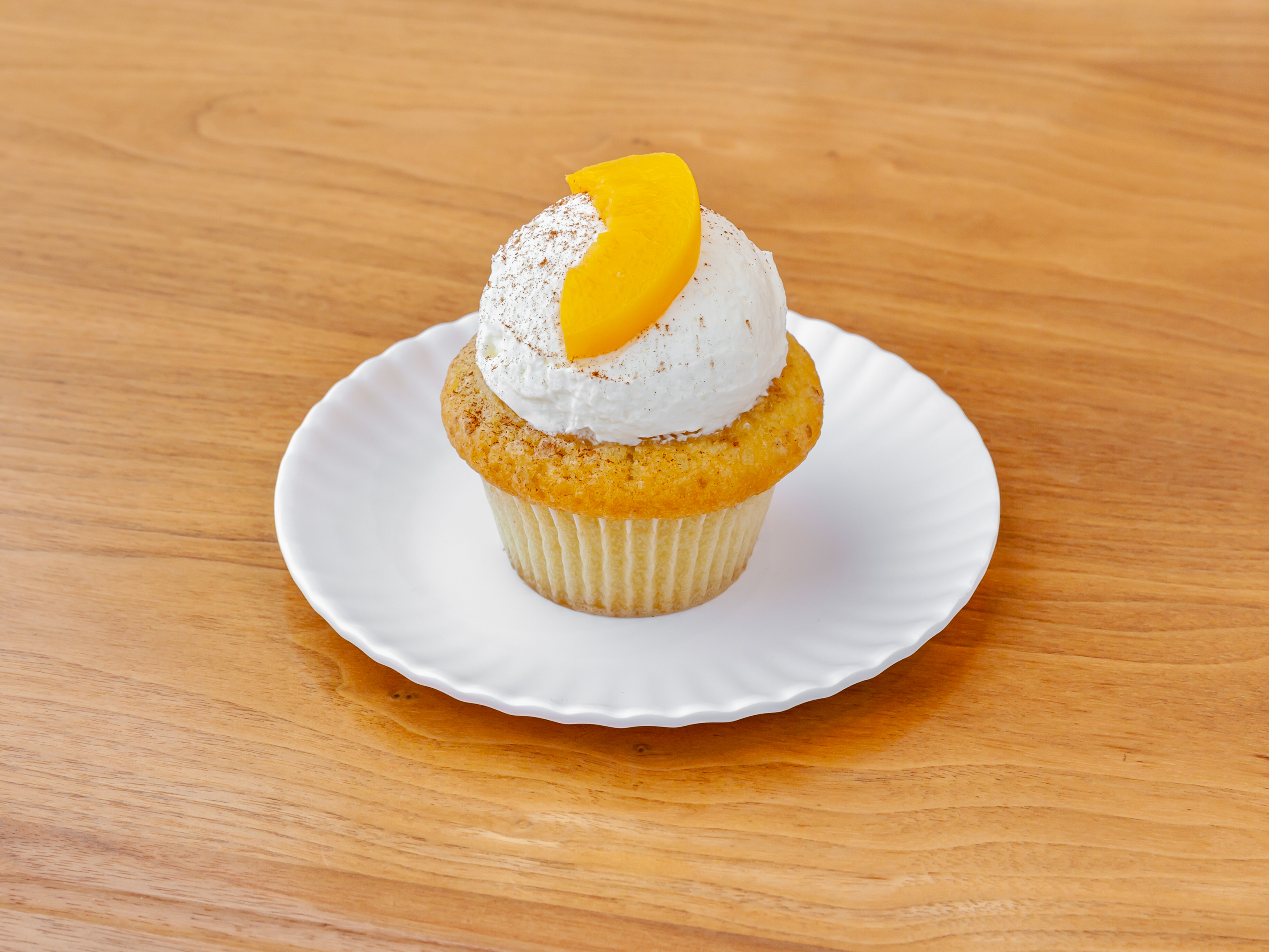 Order Peach Cobbler Cupcake food online from Molly Cupcakes store, Orland Park on bringmethat.com
