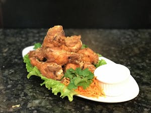 Order 14. Garlic Wings (Not Spicy) food online from Thai Time Bistro store, San Diego on bringmethat.com