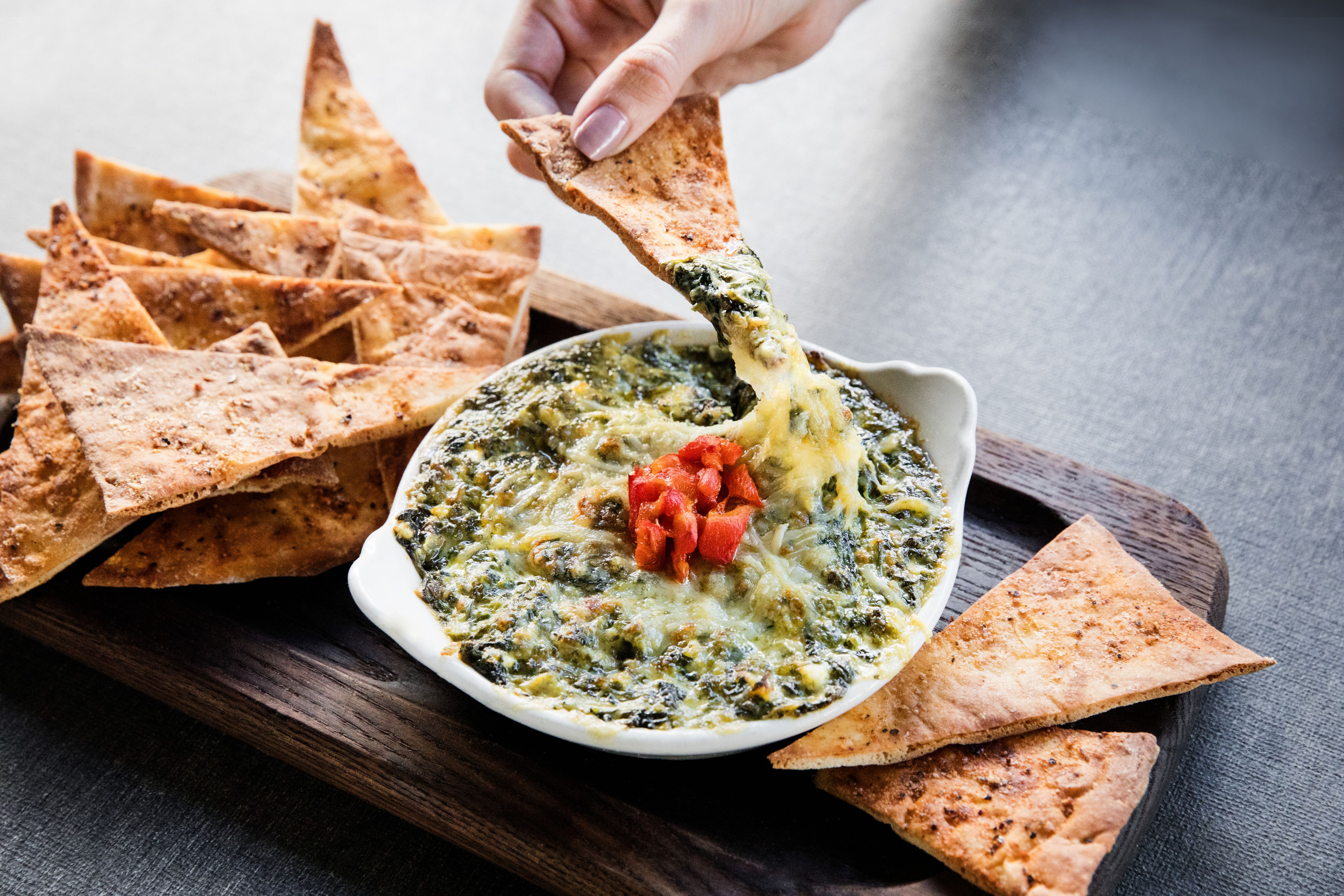 Order Spinach and Artichoke Dip food online from Paul Martin America Grill store, San Mateo on bringmethat.com