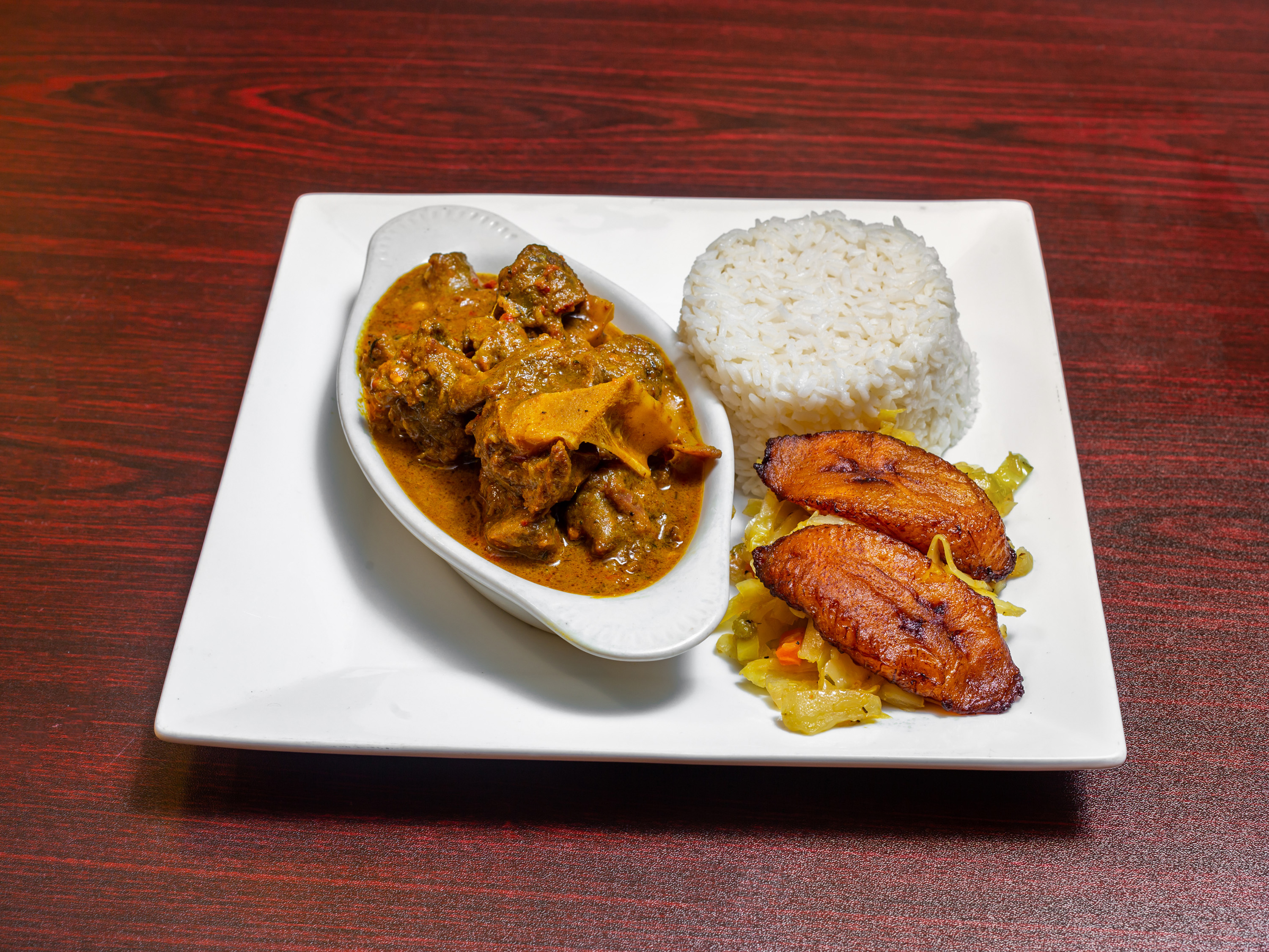 Order Curry Goat food online from Malakhi Lounge & Jamaican Restaurant store, Manassas on bringmethat.com