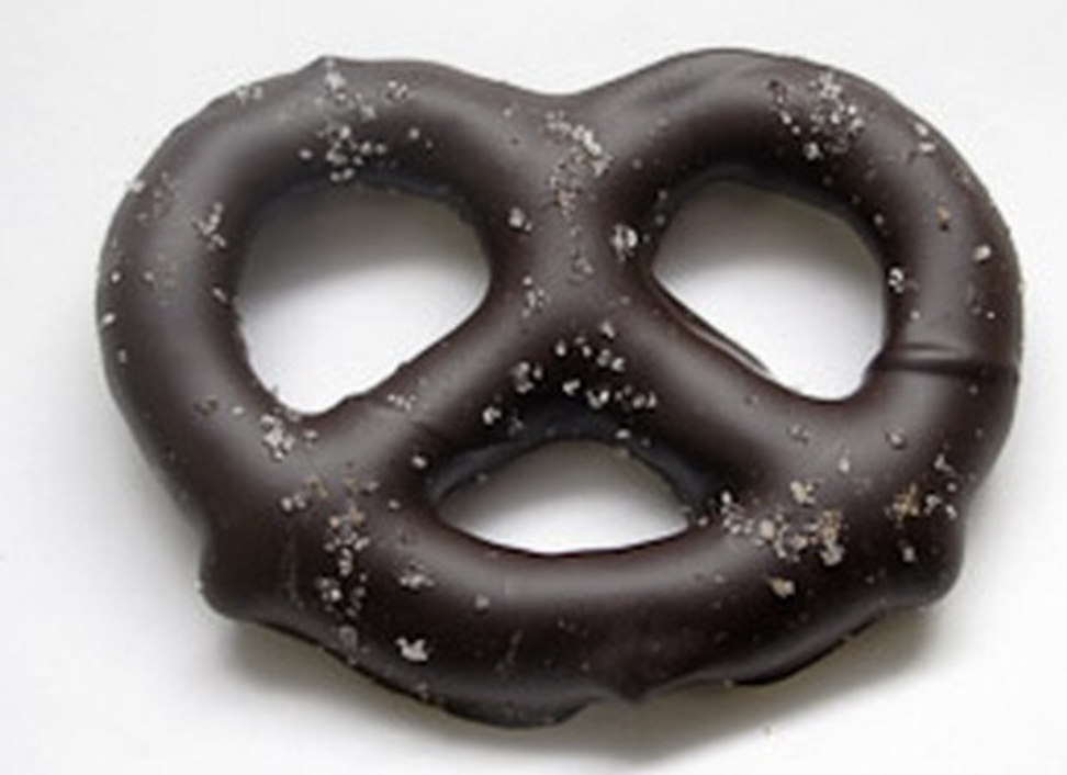 Order DARK Chocolate Covered Sea Salt Bow Pretzel food online from The Sweet Shop Nyc store, New York on bringmethat.com